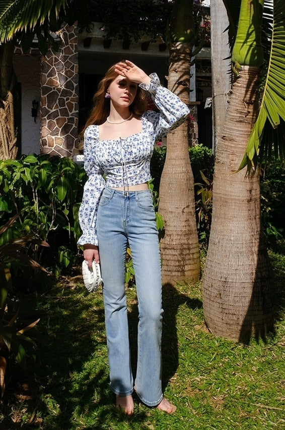 Full-length view of vintage floral corset puff-sleeve blouse outdoors