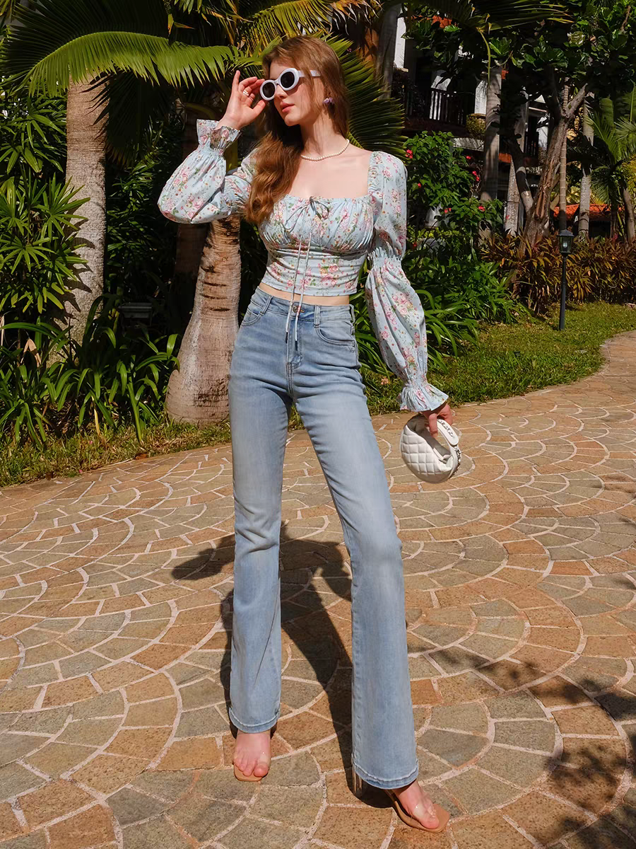 Full-length view of vintage floral corset puff-sleeve blouse with handbag