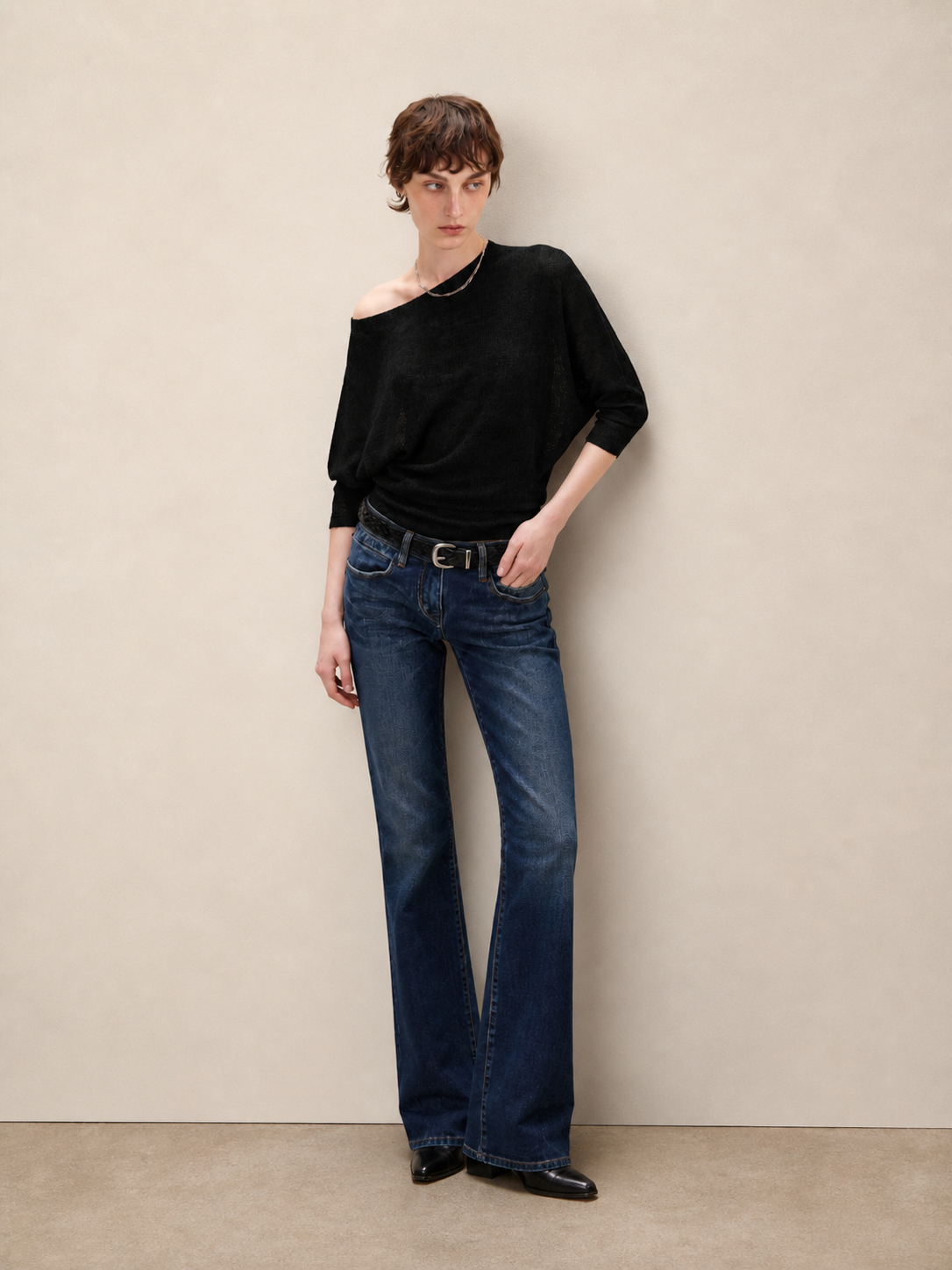 Black asymmetric off shoulder batwing knit top, full body view