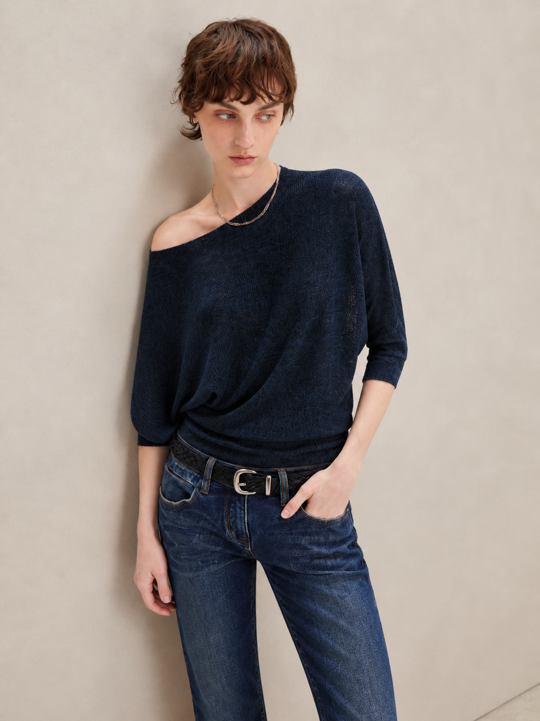 Navy asymmetric off shoulder batwing knit top, close-up view