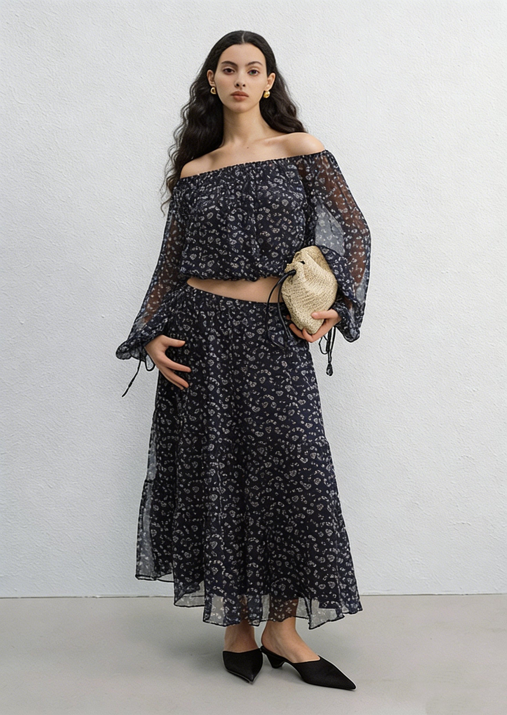 BapHood black floral off-shoulder blouse close-up showing sheer sleeves and soft gathered neckline