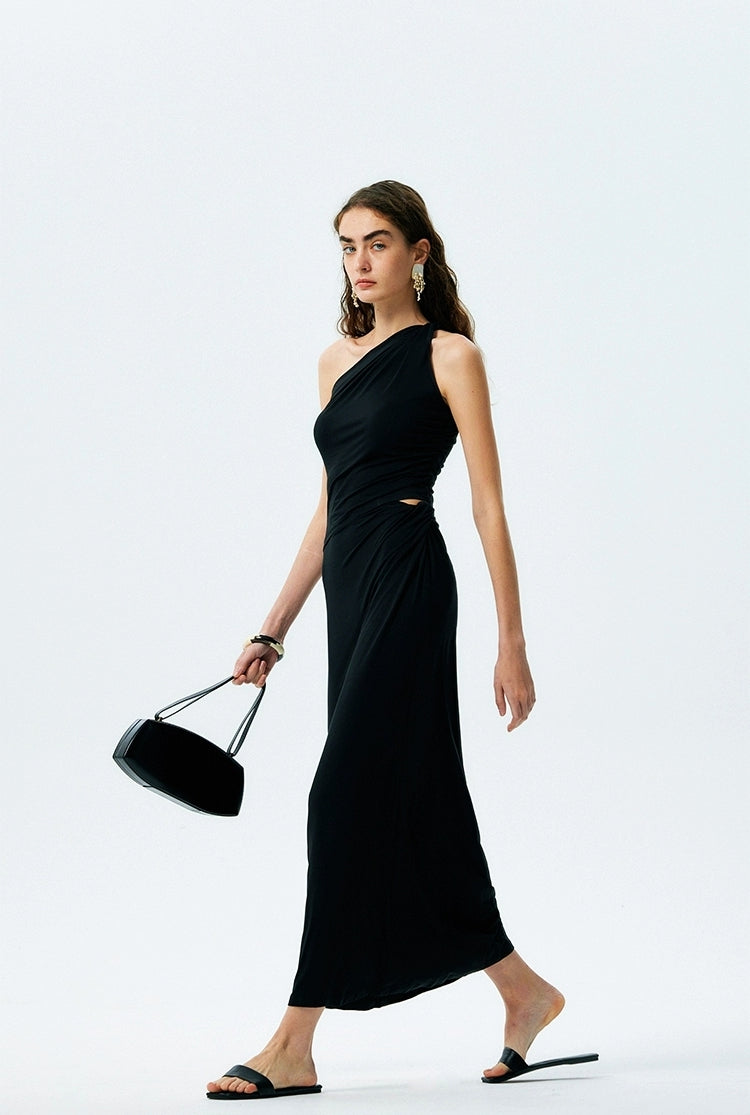Three-quarter view of black one-shoulder ruched maxi dress