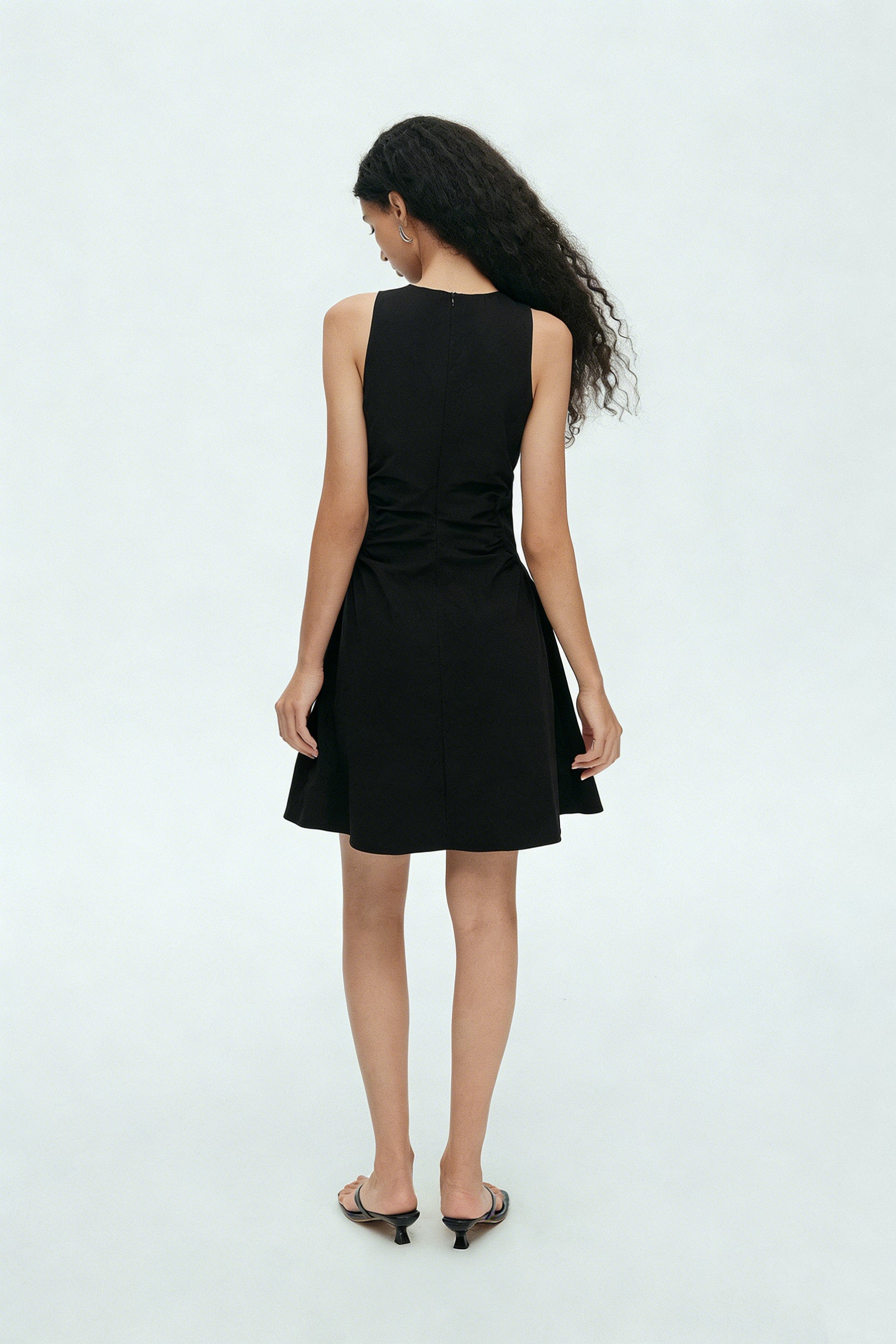 BapHood black sleeveless mini dress back view with clean lines and softly flared skirt
