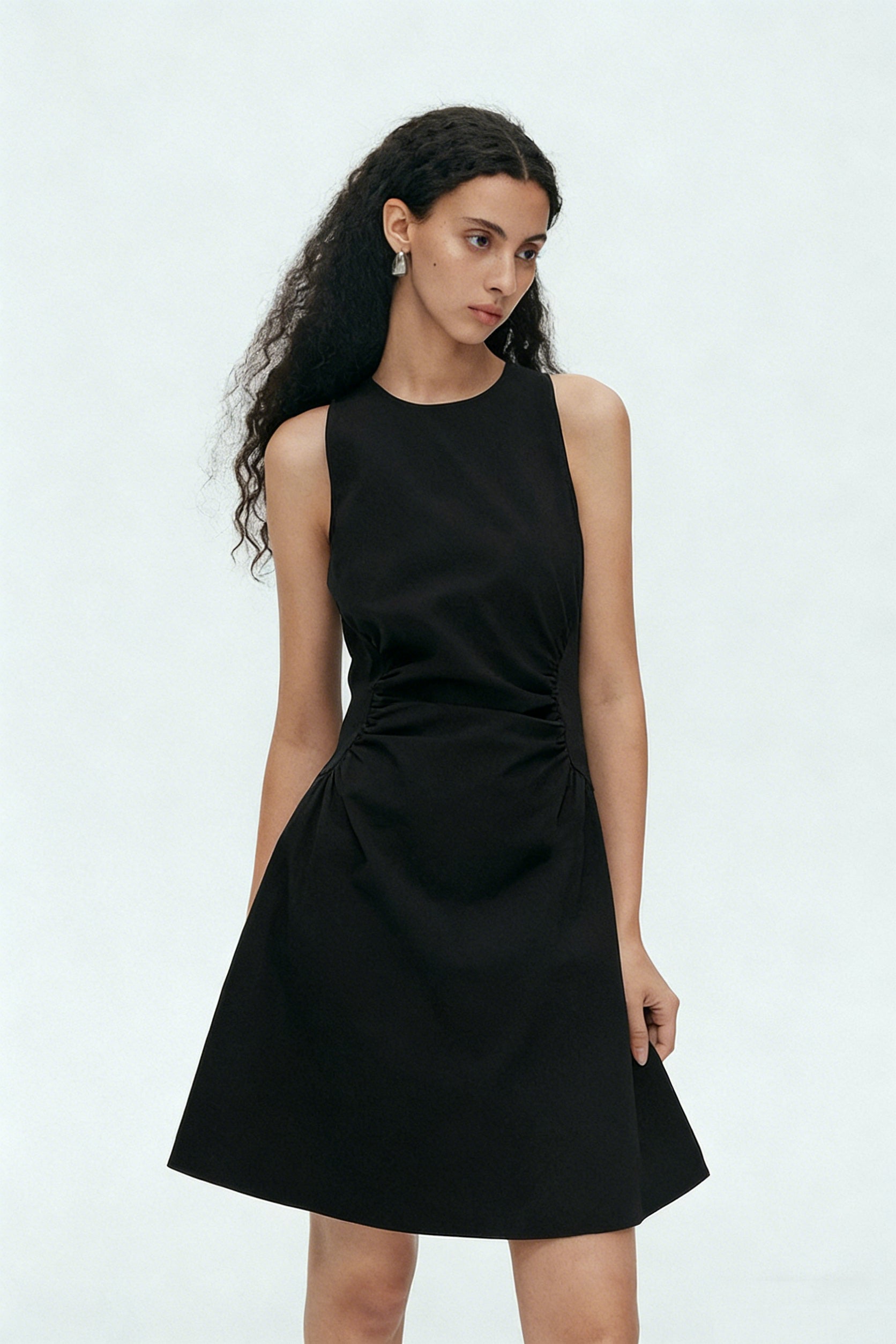 BapHood black sleeveless mini dress with ruched waist and sculpted A-line silhouette