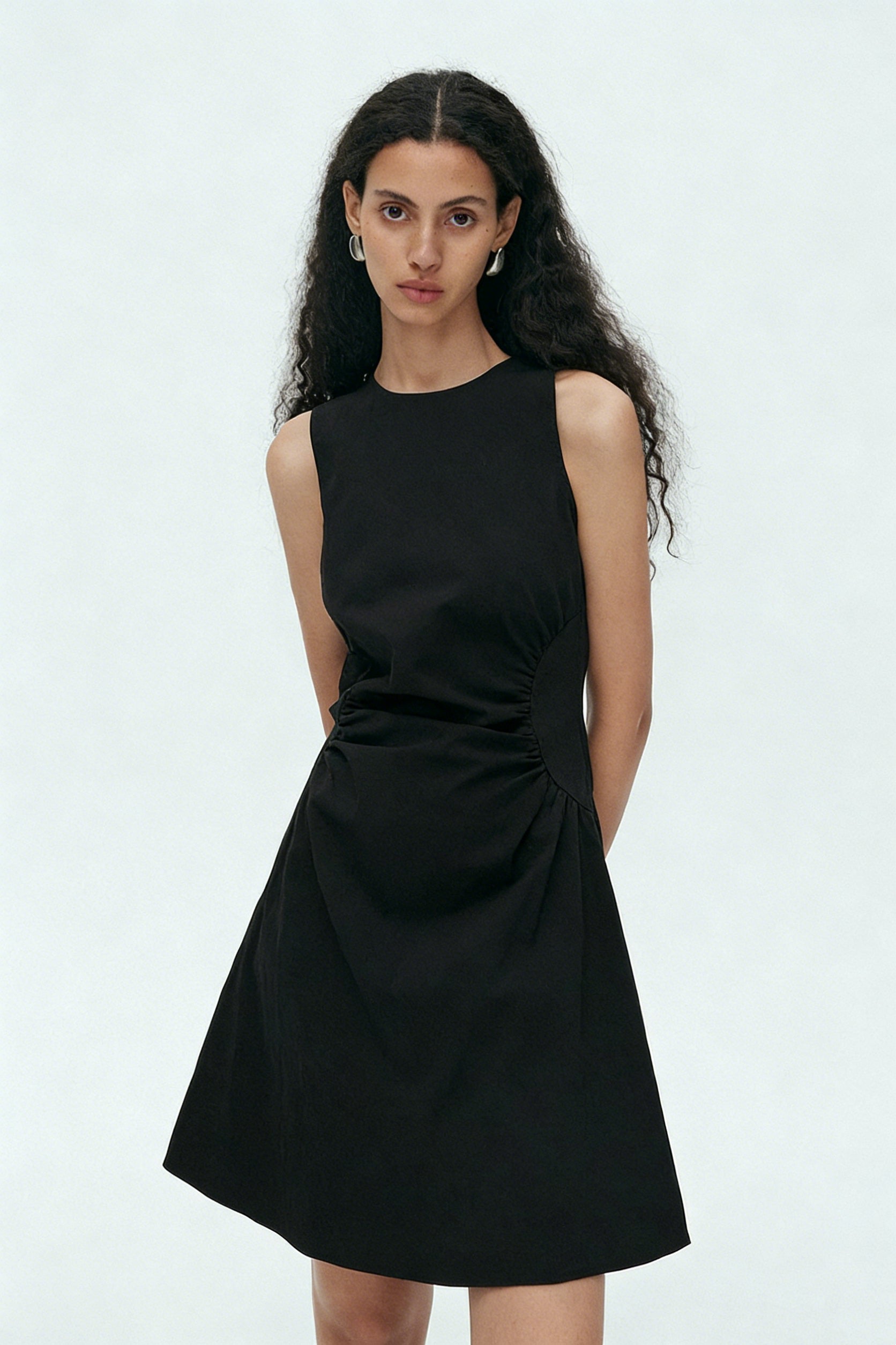 BapHood black mini dress detail showing ruched waist and structured A-line skirt shape