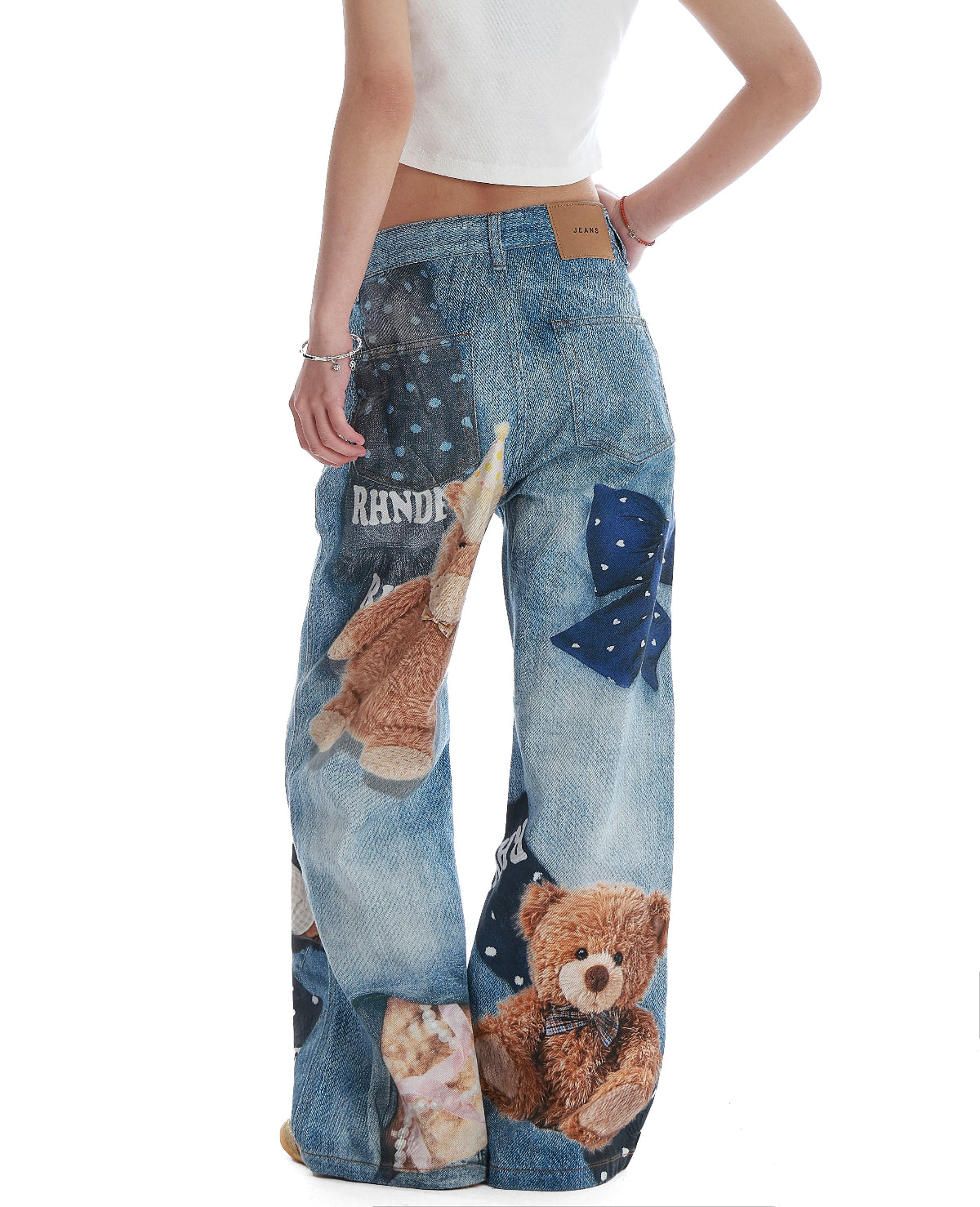 BapHood blue patchwork print wide-leg jeans showing the back view with bold graphic details.