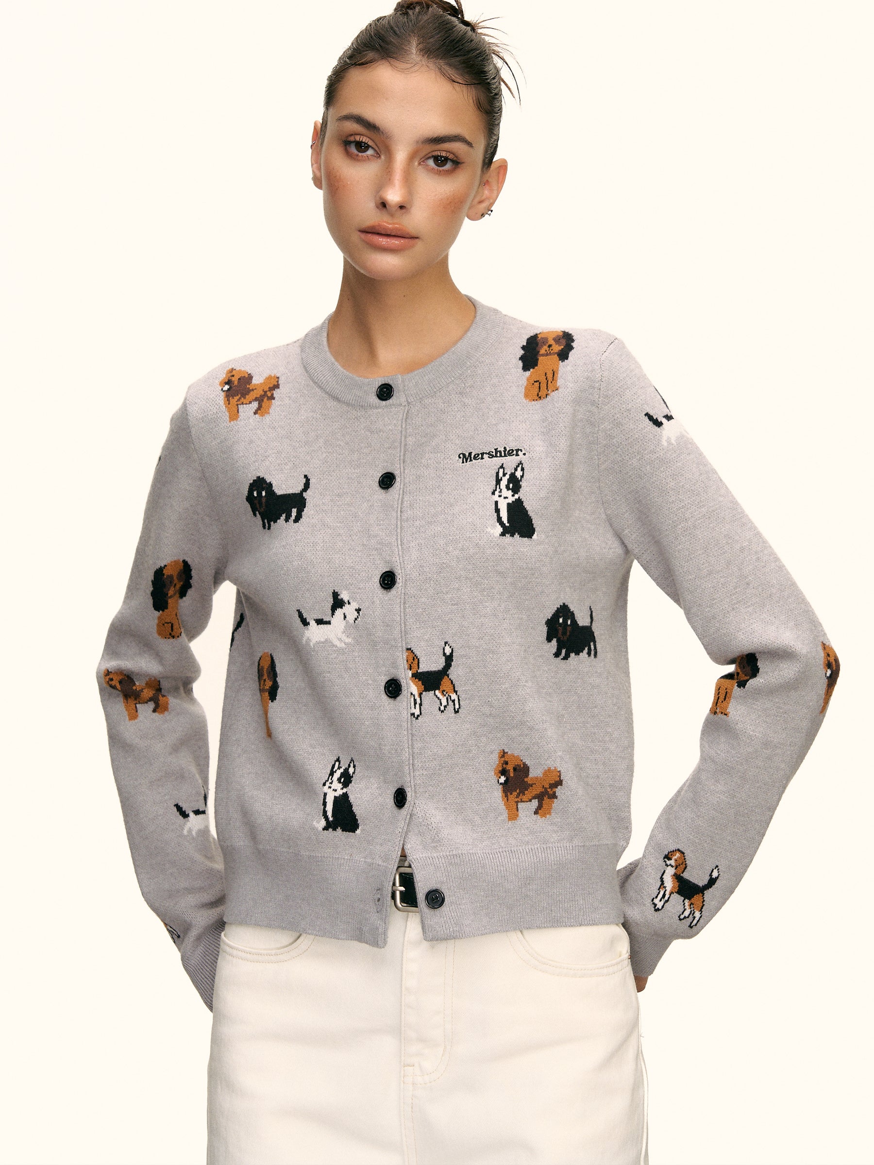 Close-up of grey cardigan showing cute puppy intarsia details