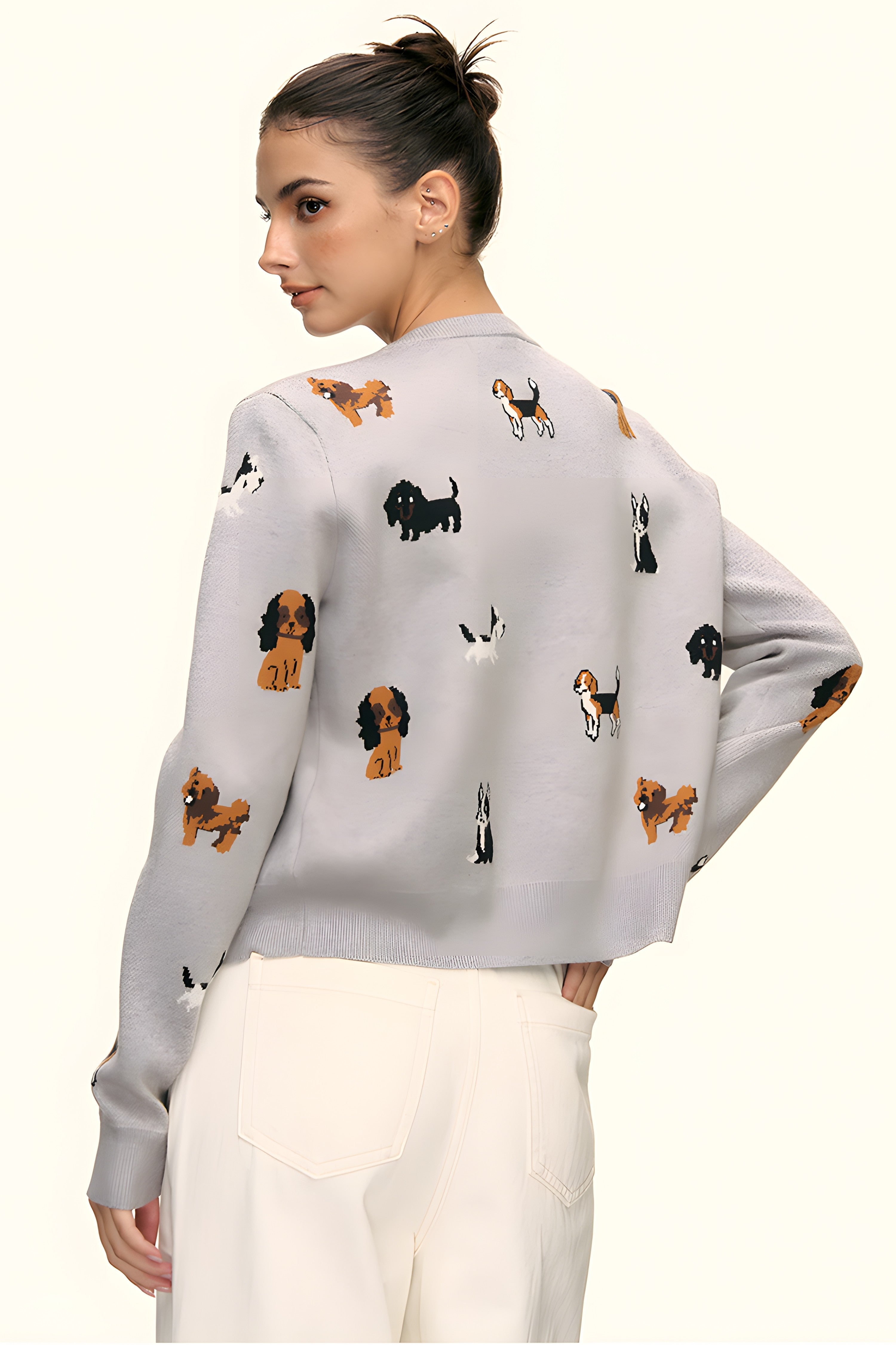 Back view detail of grey knit cardigan with scattered puppy motifs