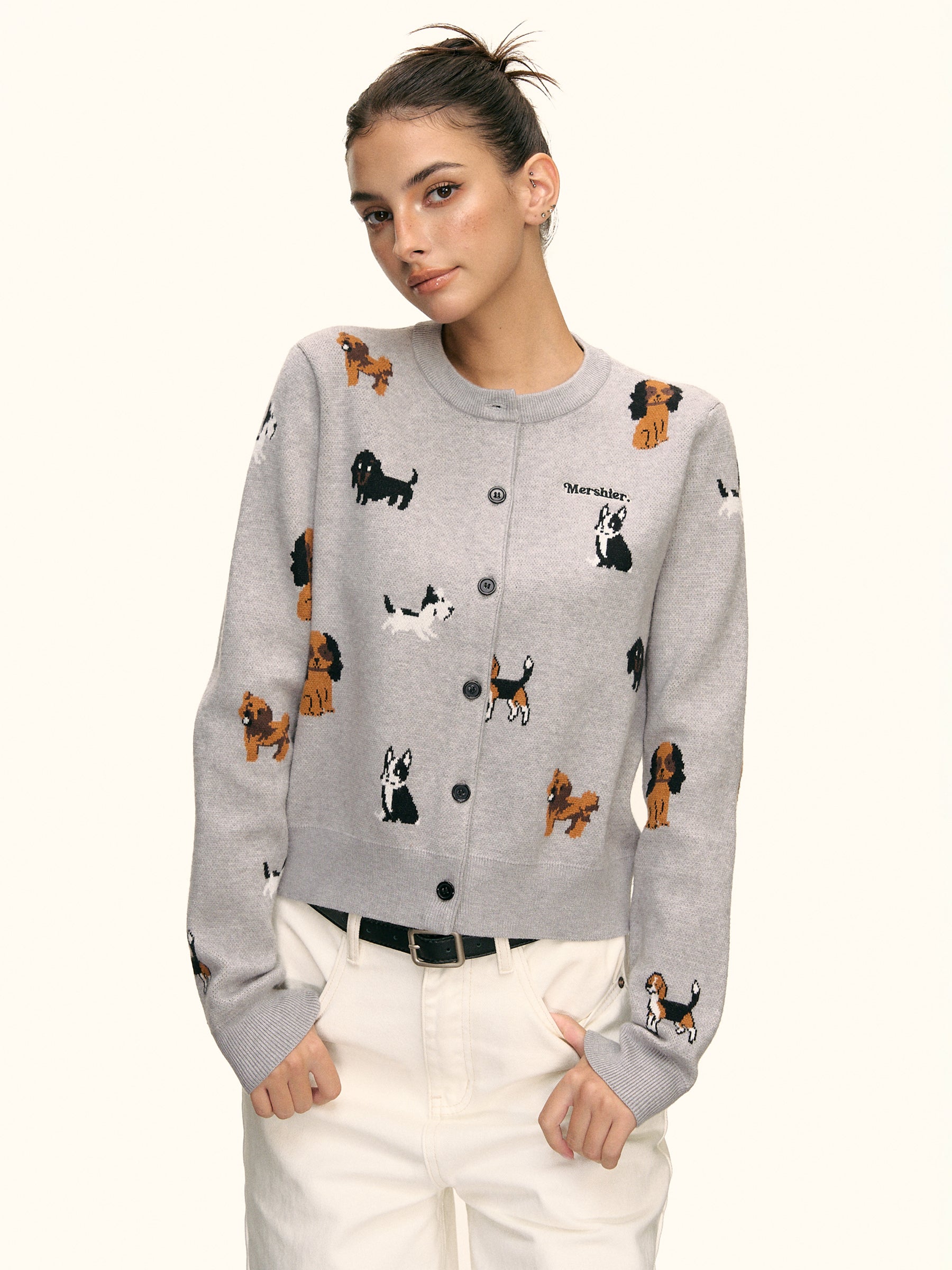 Side angle view of grey cardigan with all-over puppy pattern