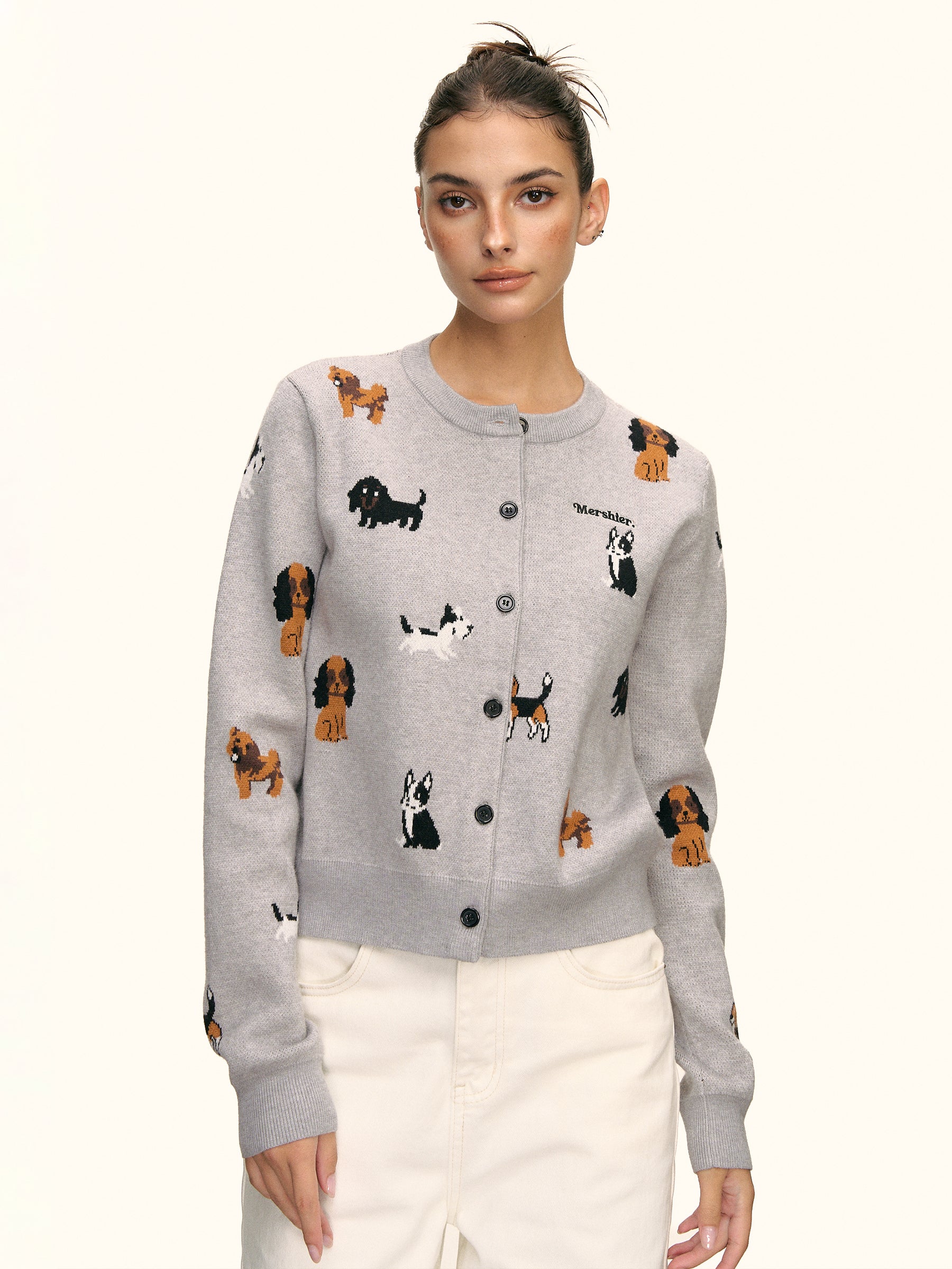 Front view of puppy parade grey knit cardigan buttoned up