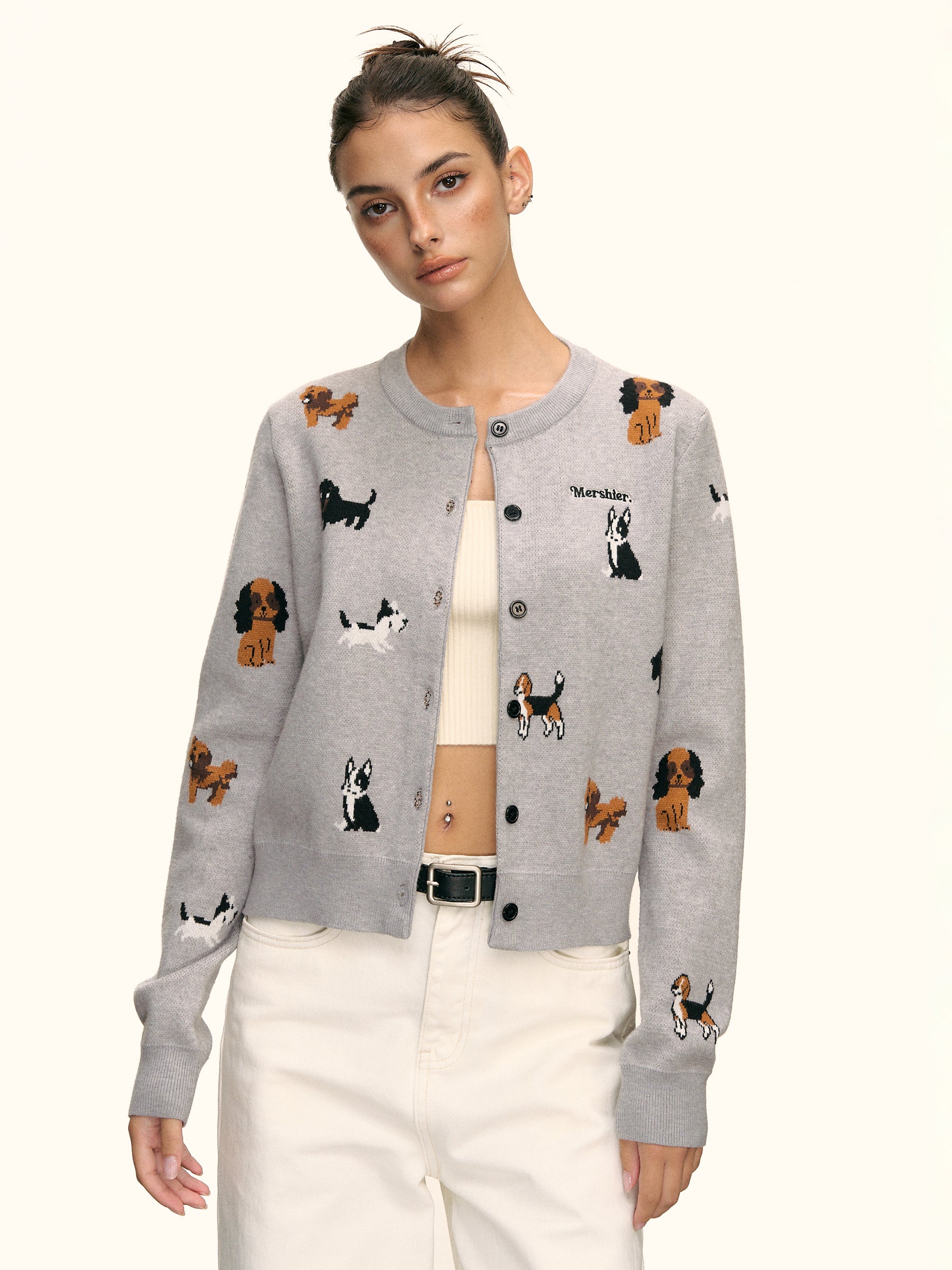 Grey puppy knit cardigan styled open over a cream crop top