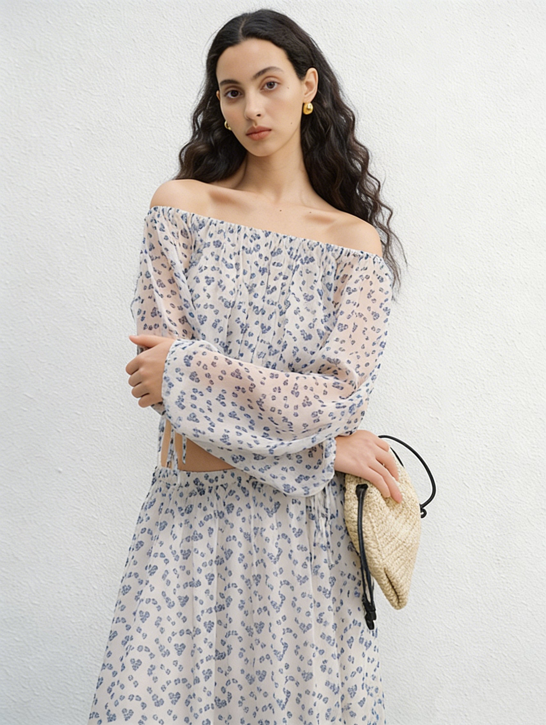 BapHood cream floral off-shoulder blouse with sheer sleeves styled with flowing midi skirt side view