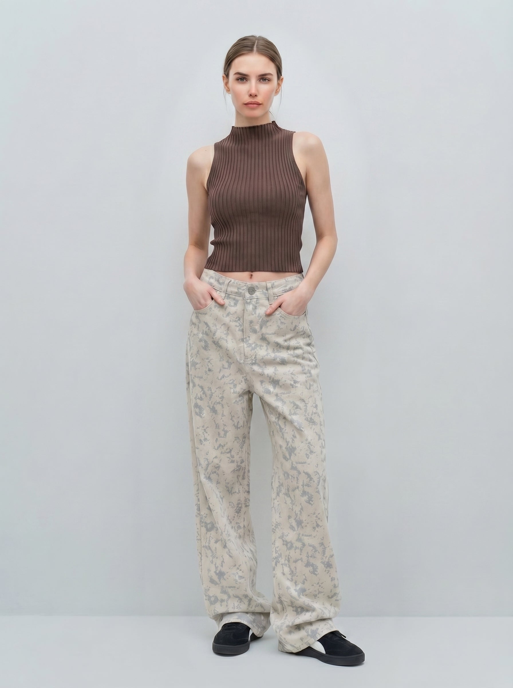 Front view of digital camo wide-leg jeans in sand pixel wash