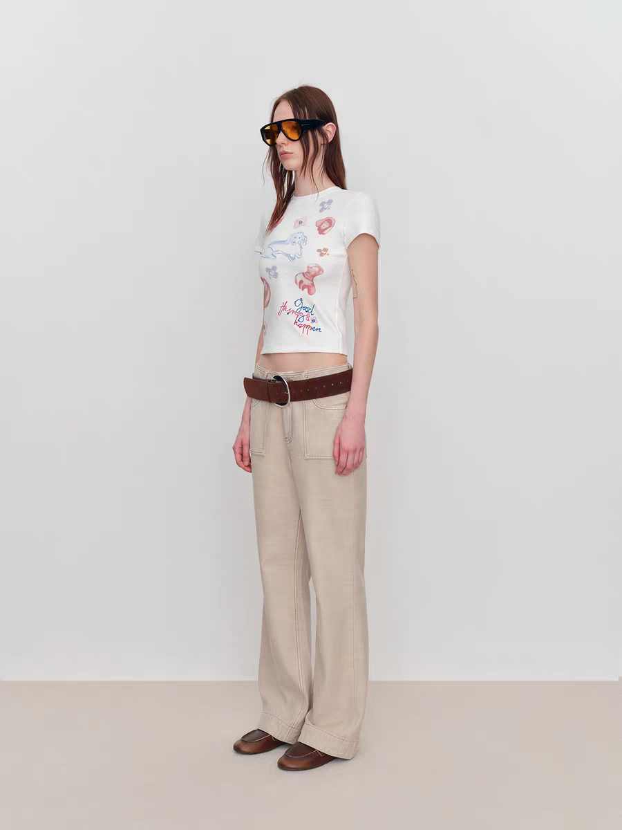 Side view of fitted white baby tee showing cropped length and silhouette