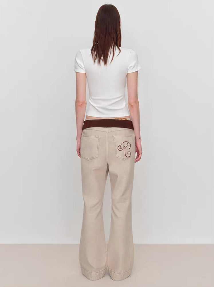 Back view of white baby tee showing clean back and fitted shape