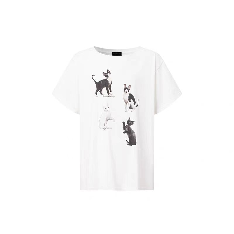 Flat lay product image of white oversized kitty graphic tee dress