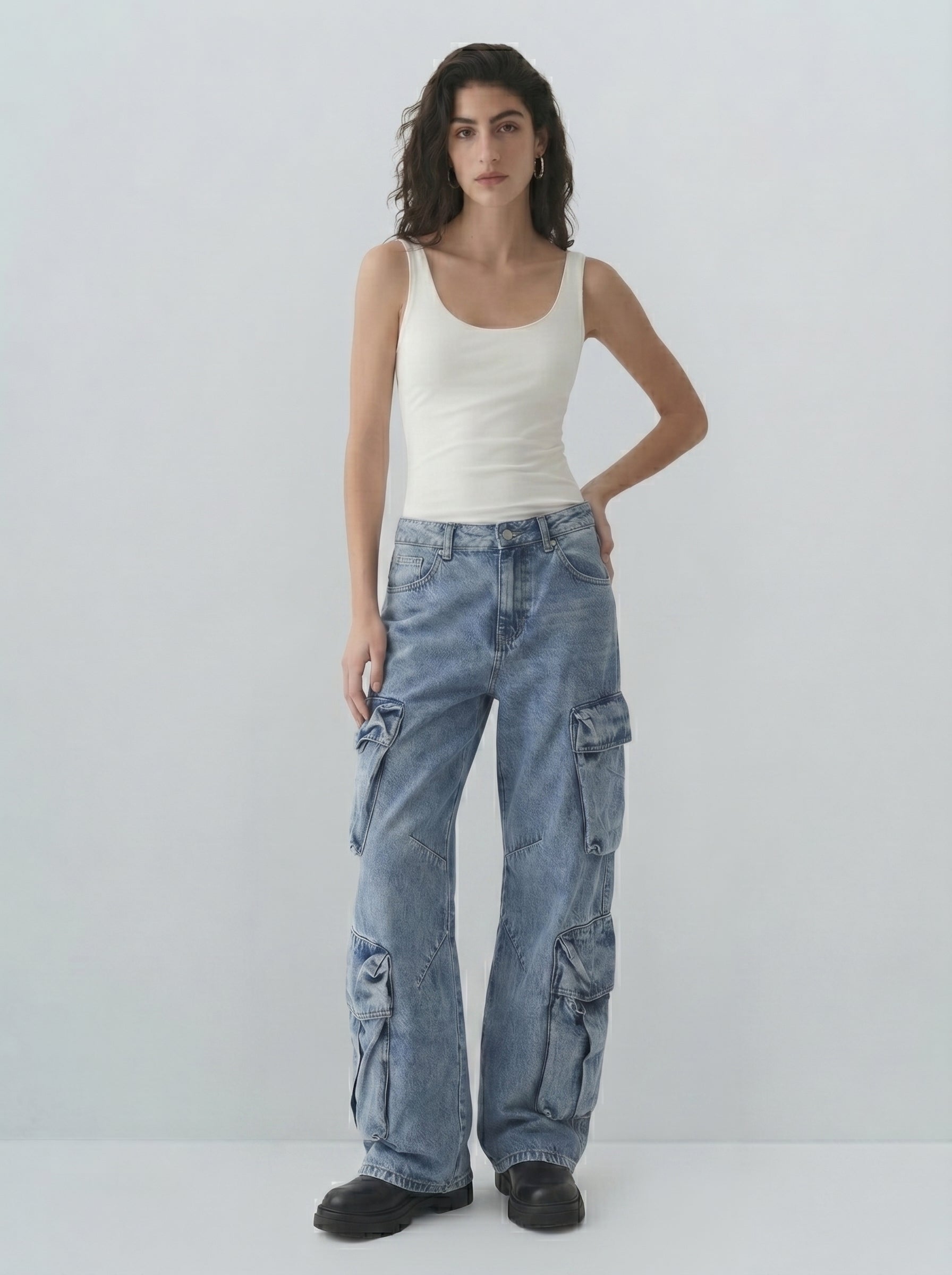 Full-length view of multi-pocket deconstructed cargo jeans