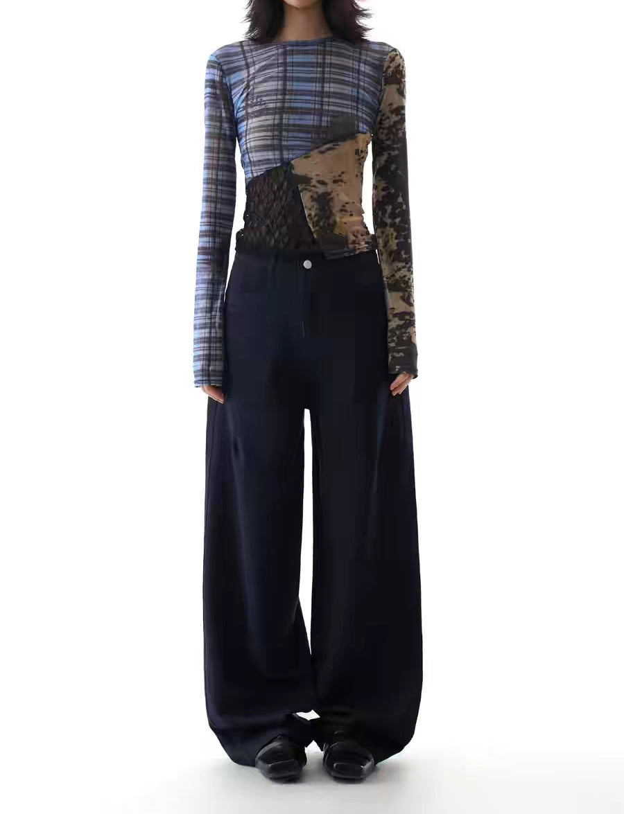 Model wearing navy high-waist wide-leg utility trousers, front view