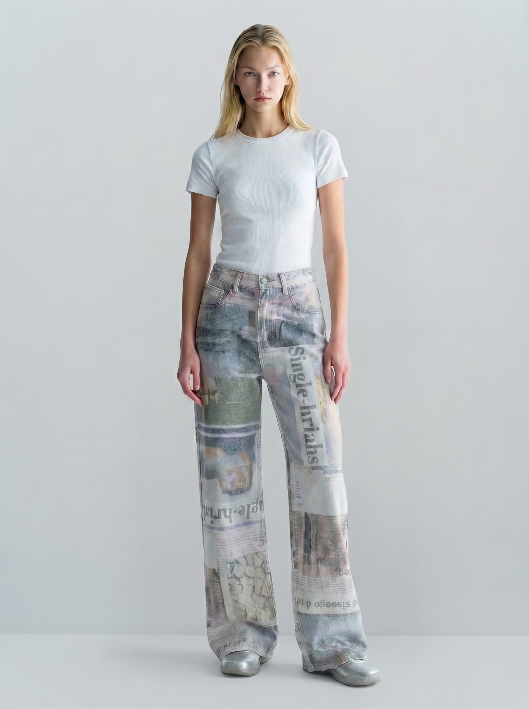 Full-length front view of newspaper print wide-leg jeans