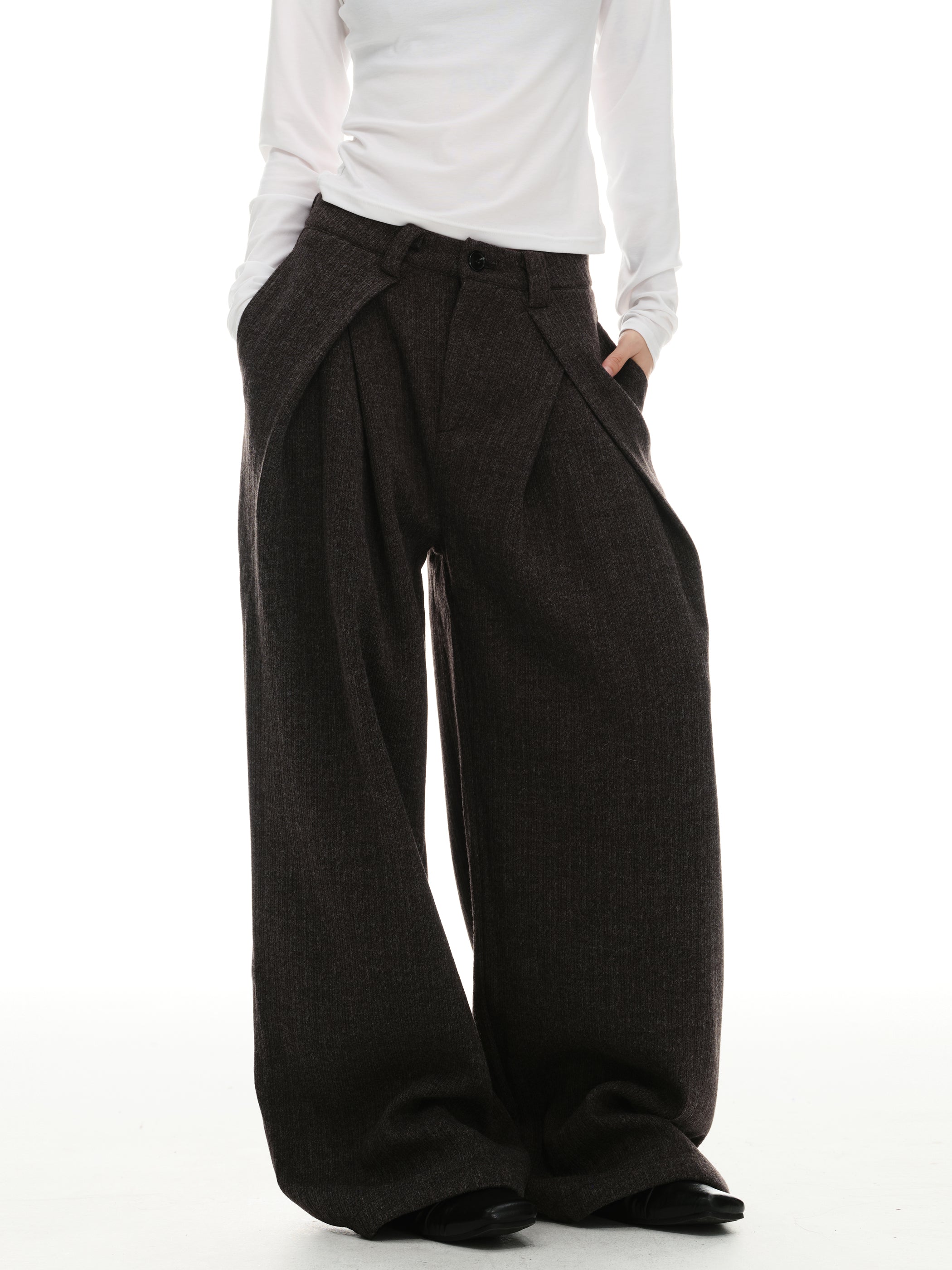 Side angle view of dark mocha draped wide-leg trousers with relaxed wide legs