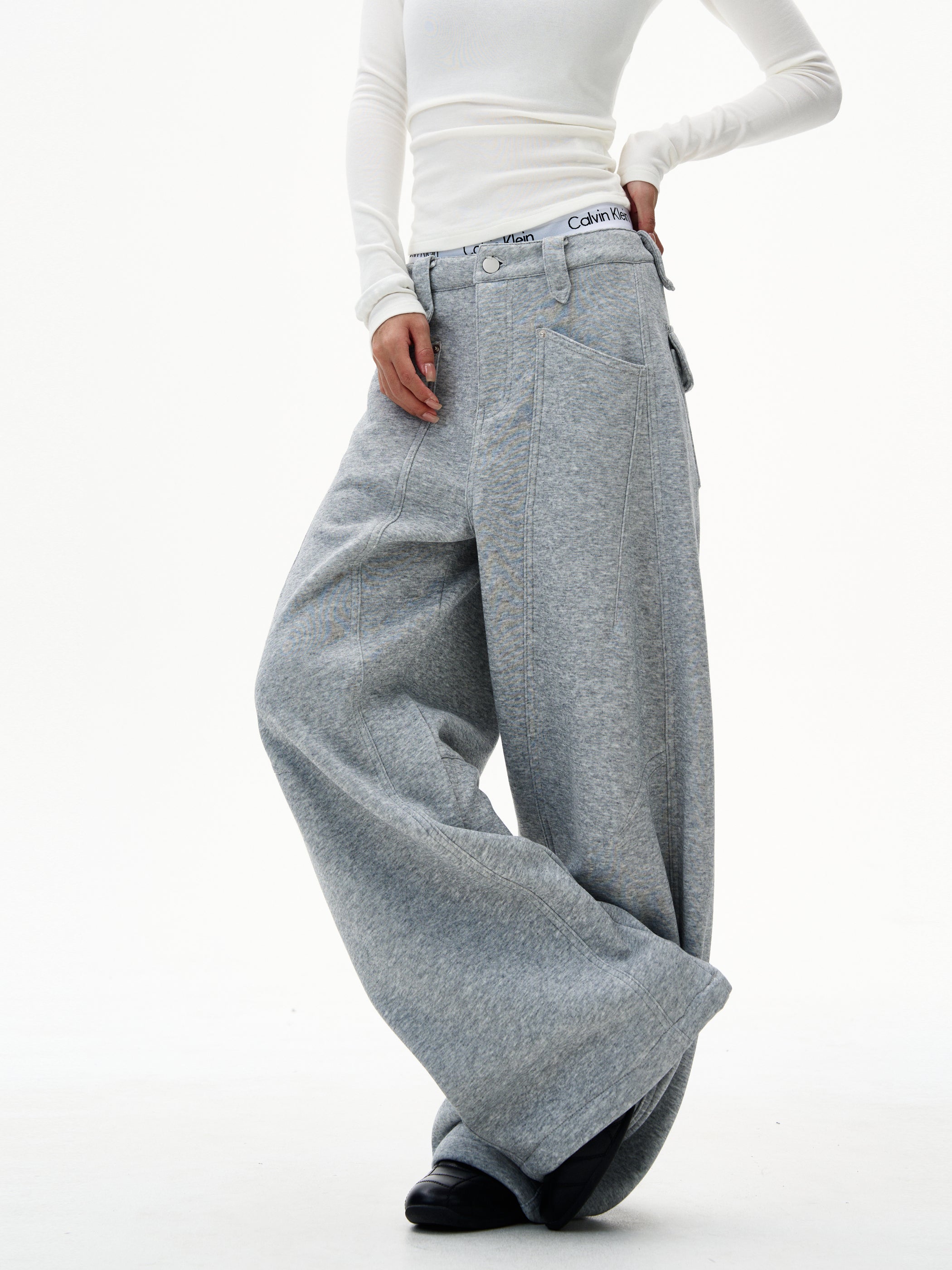 Model wearing heather grey utility wide-leg sweatpants with jean-style seams