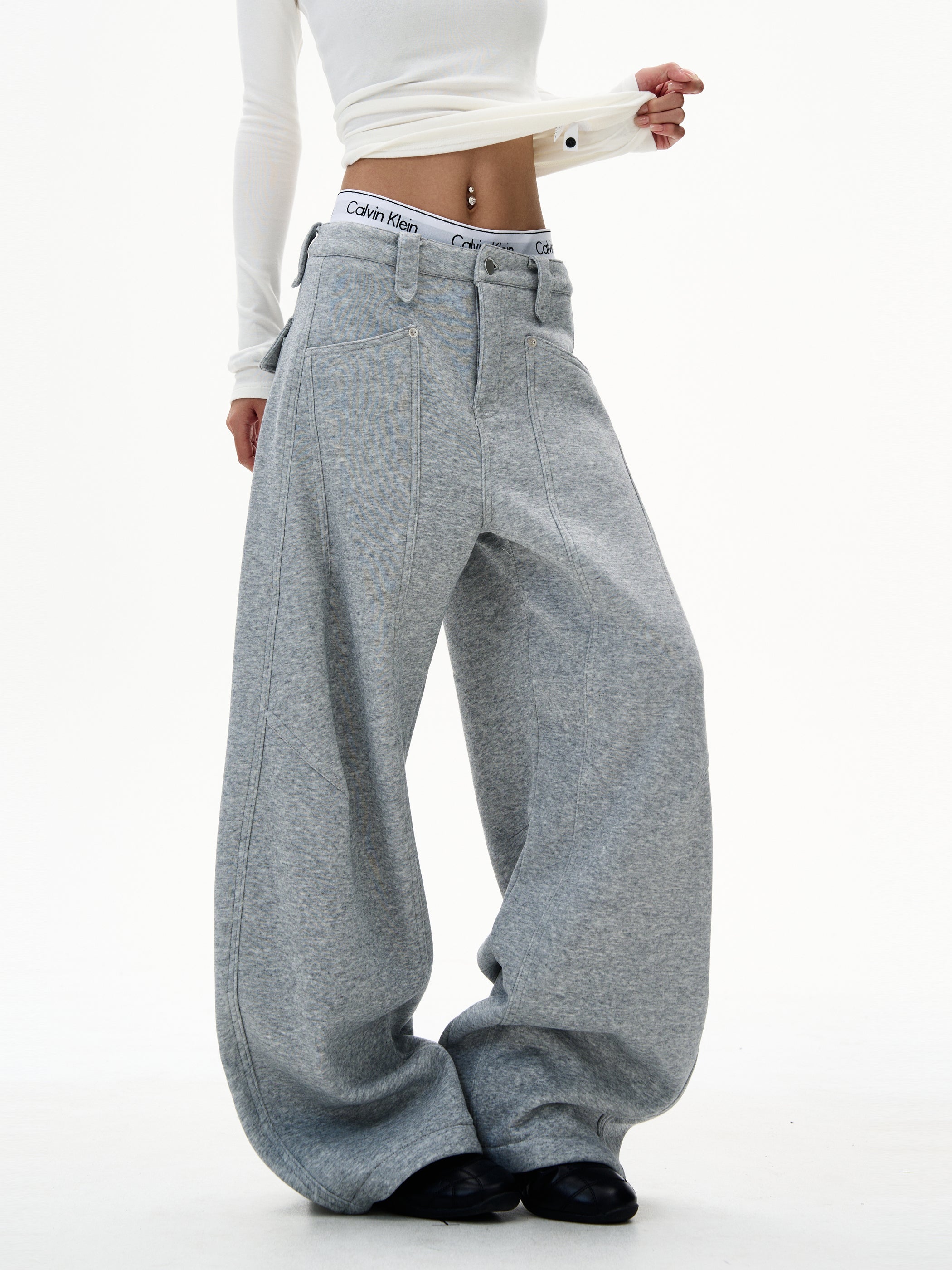 Model in heather grey ultra wide-leg sweatpants styled with white long-sleeve top