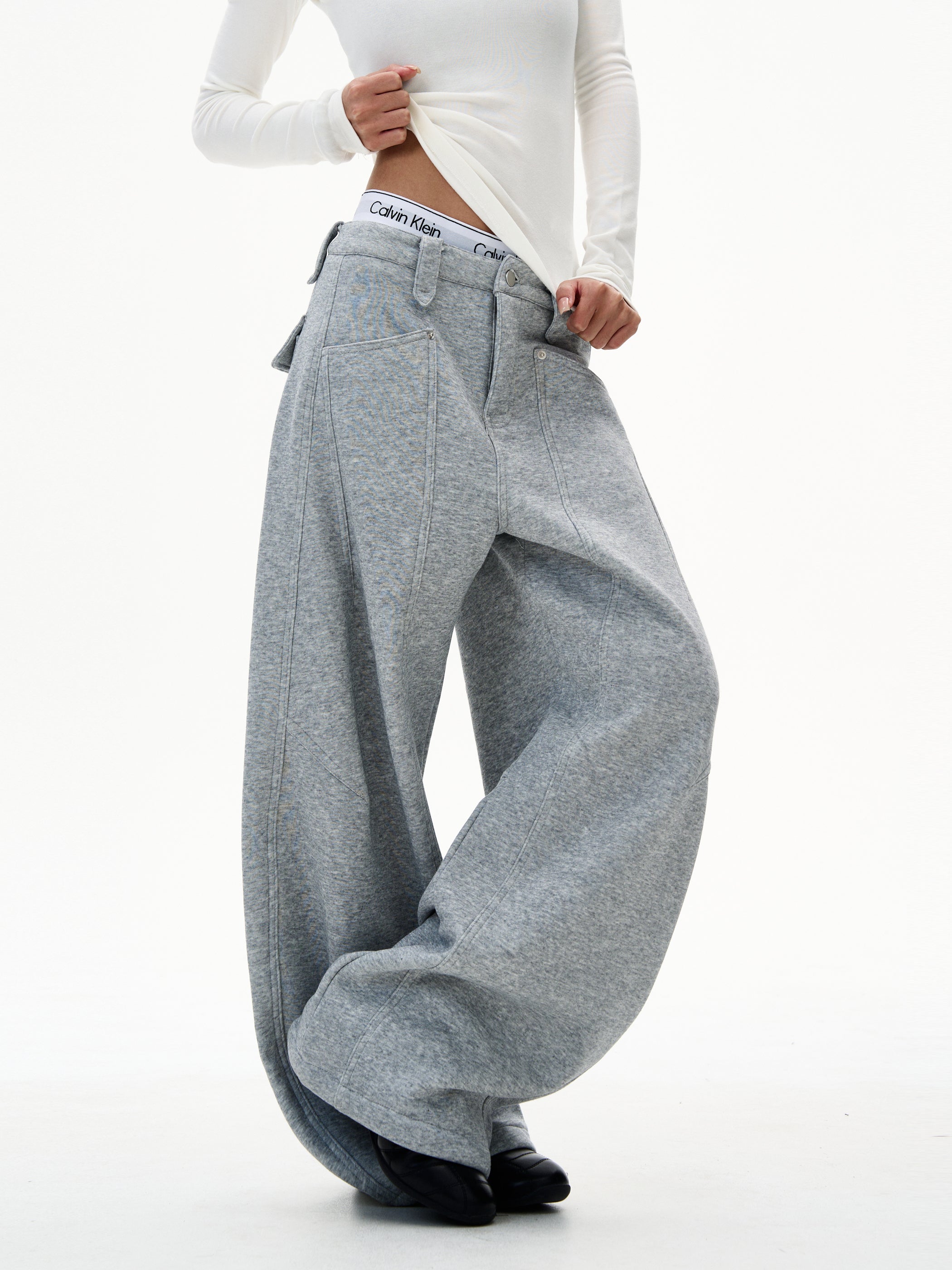 Side angle of heather grey ultra wide-leg sweatpants with puddle hem