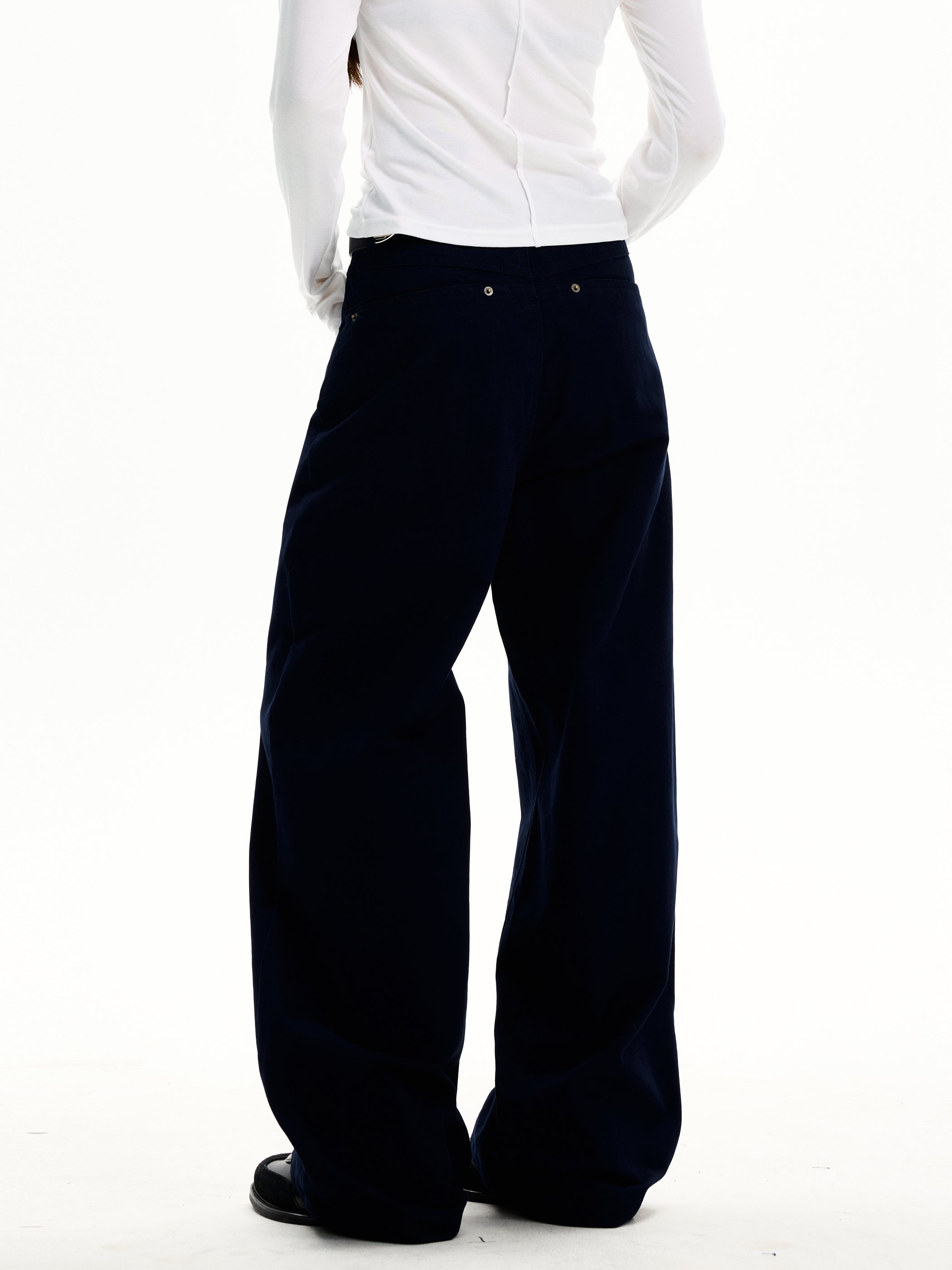 Back view of ink navy wide-leg trousers with clean utility pocket detail