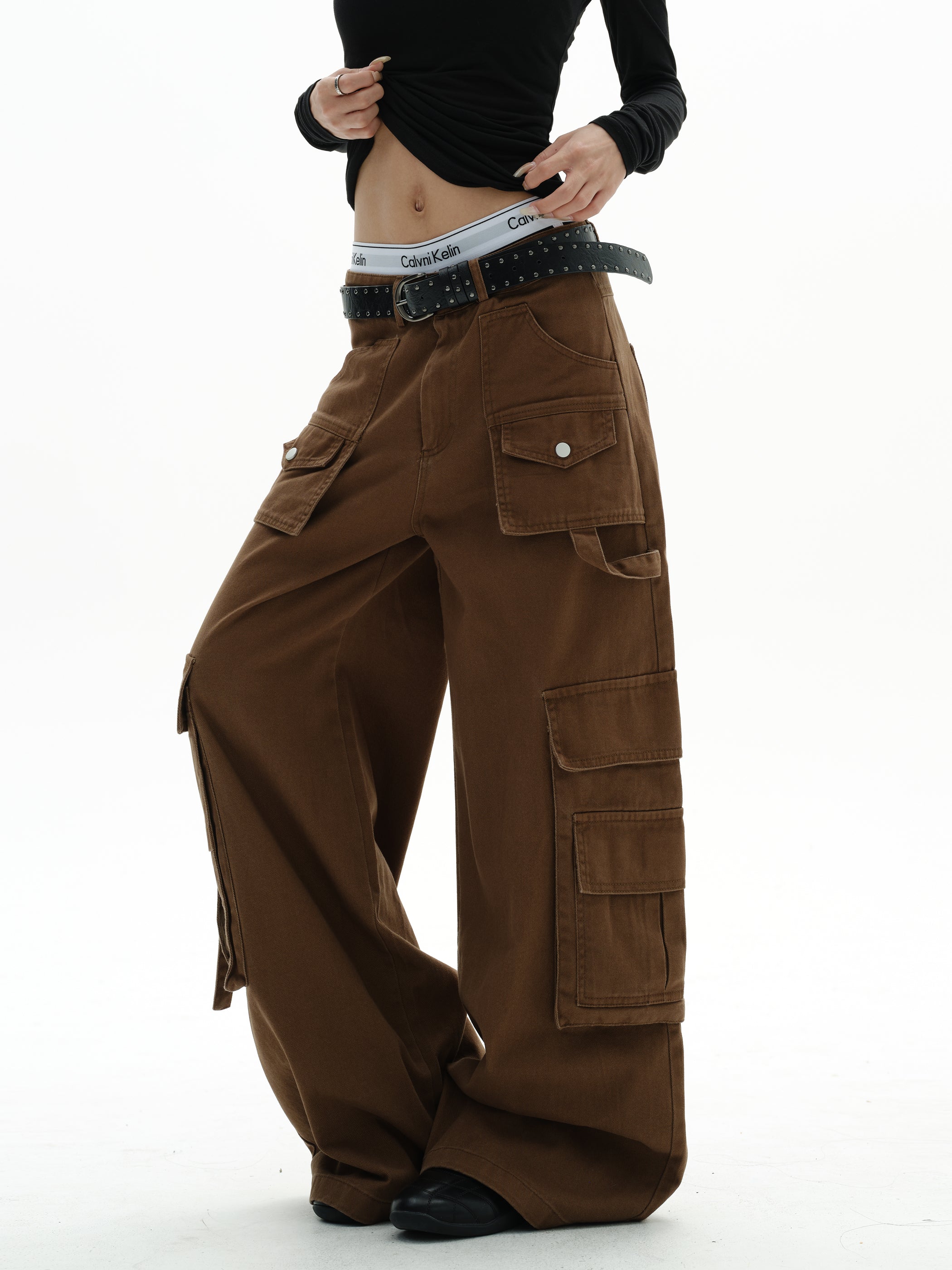 Side angle of mocha ultra wide-leg cargo trousers showing strap detail on leg