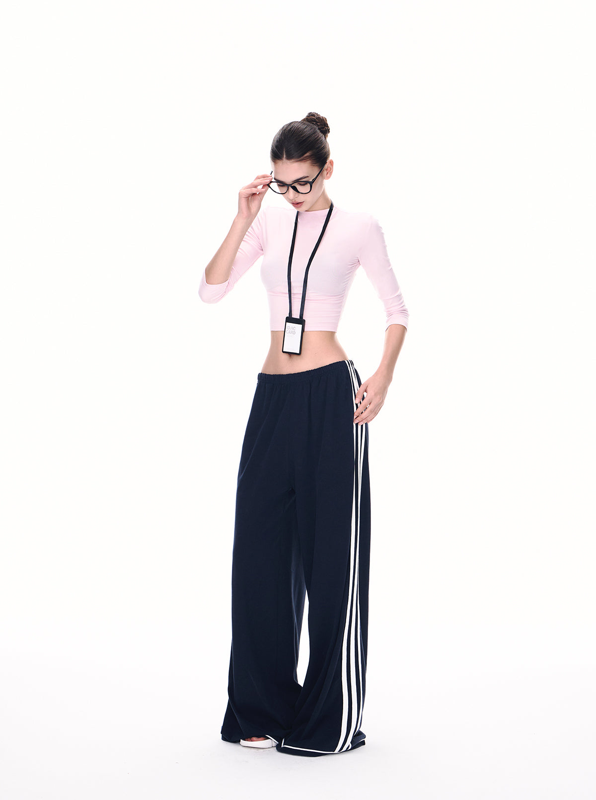 Full-body shot of navy side stripe wide leg pants in motion