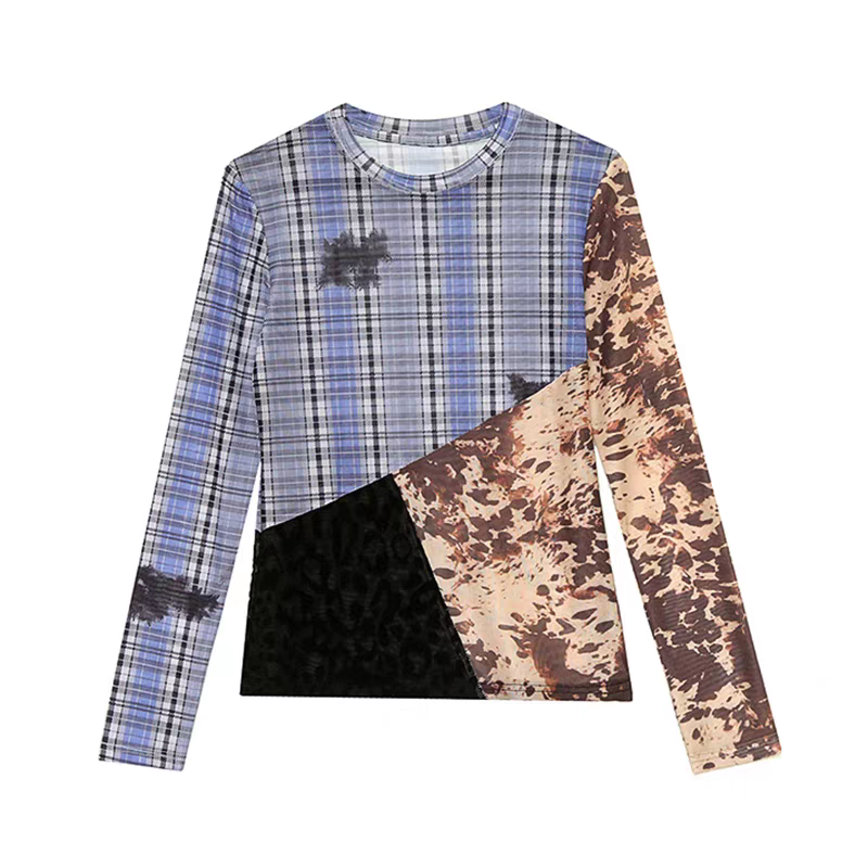 Close-up of mixed plaid and camo print patchwork fabric on mesh top.