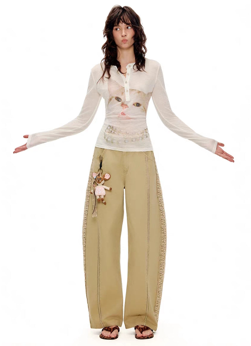 Model wearing ivory kitty print Henley long sleeve top, front view