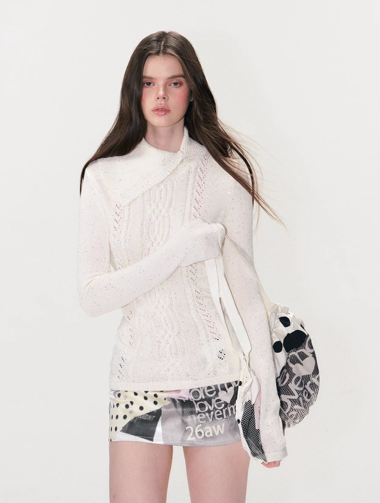 Model wearing polka collage mini skirt, front view