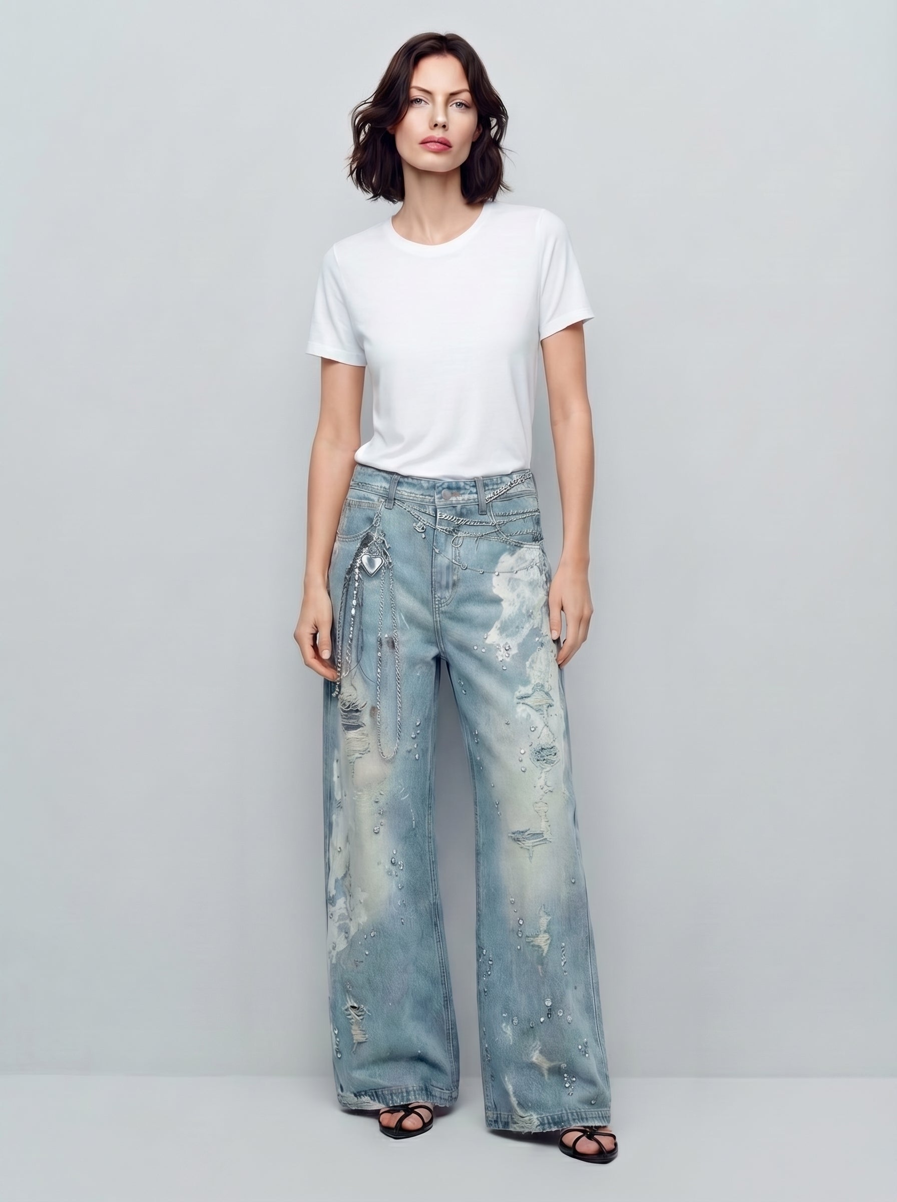 Washed wide-leg jeans with rhinestone chain detail, full-length front view