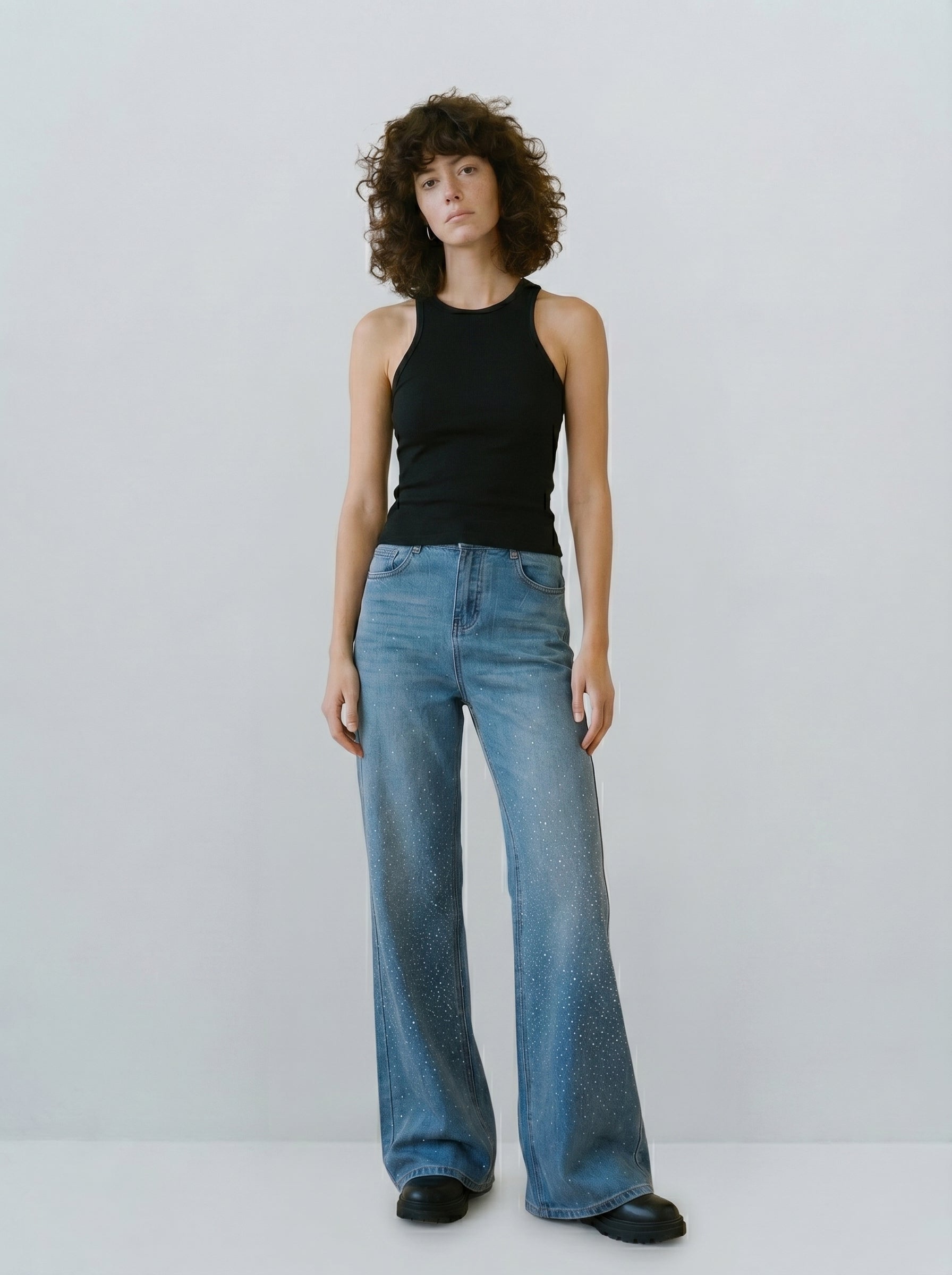 Rhinestone sparkle flare jeans on model