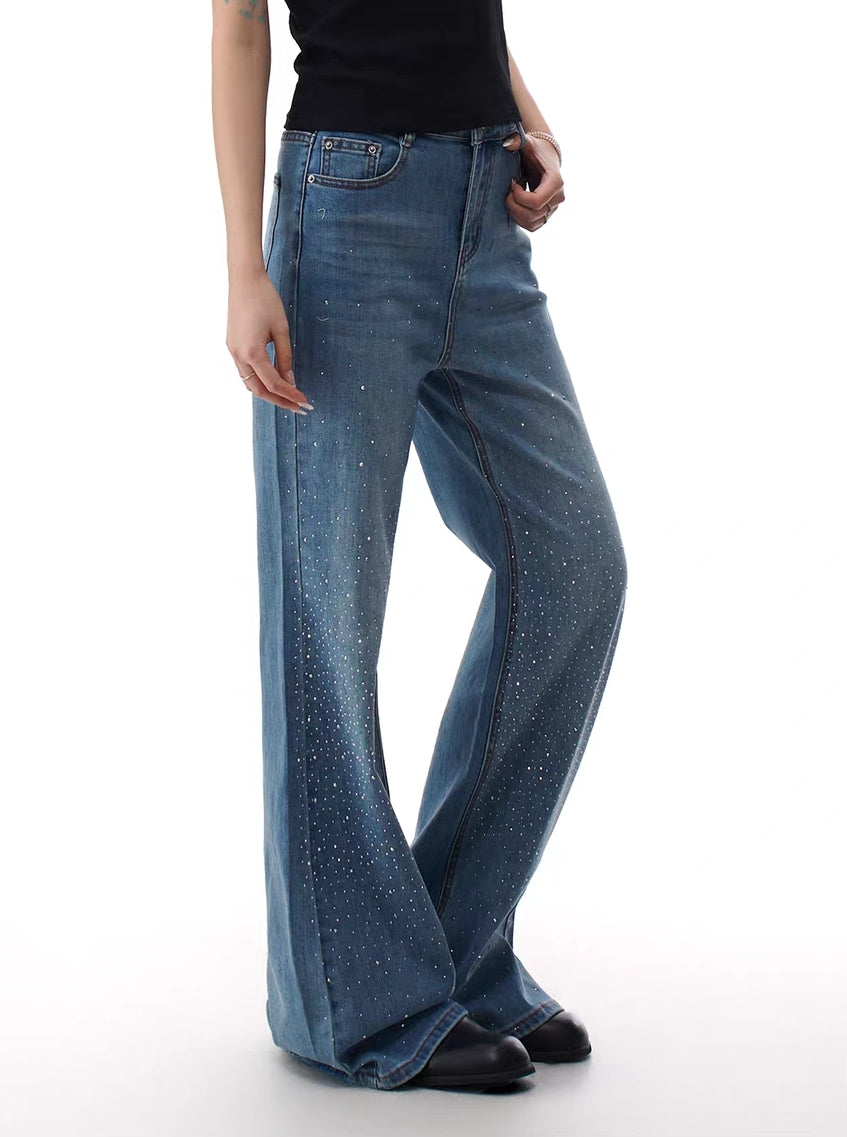 Model wearing mid-wash rhinestone micro-flare jeans, front view