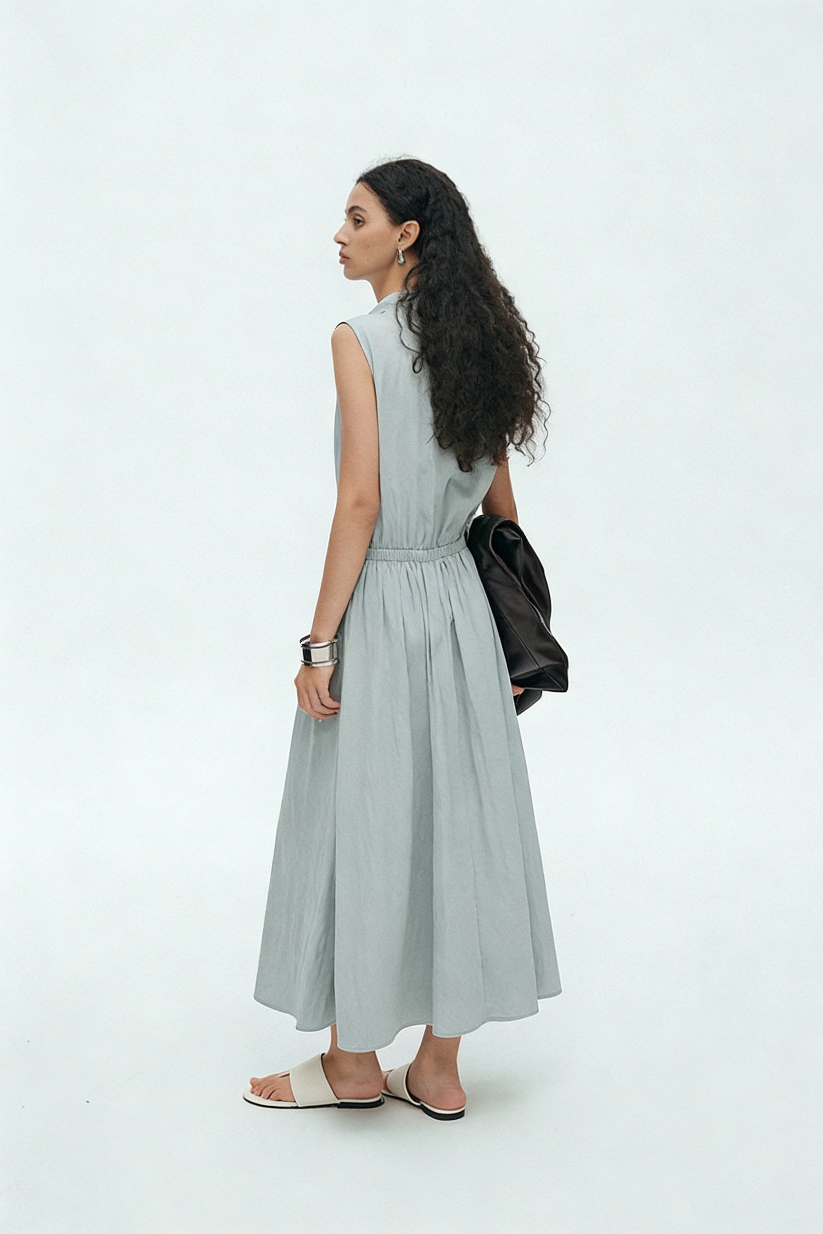 BapHood sage sleeveless midi dress back view showing elastic waist and flowing A-line skirt