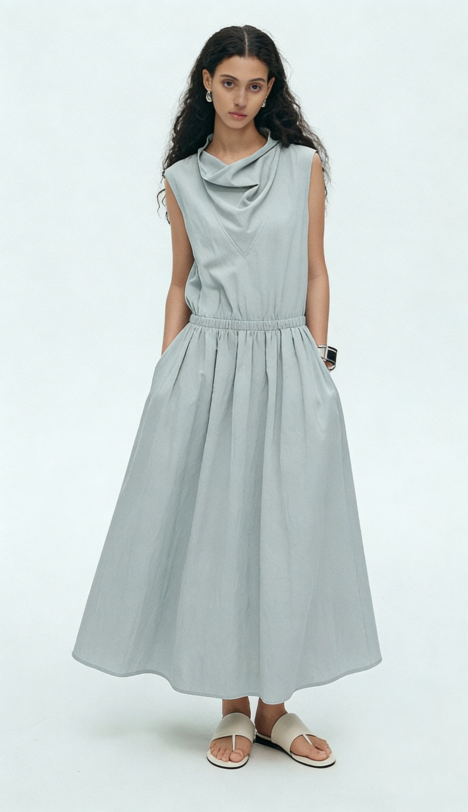 BapHood sage sleeveless midi dress with draped neckline, elastic waist, and relaxed flowing skirt