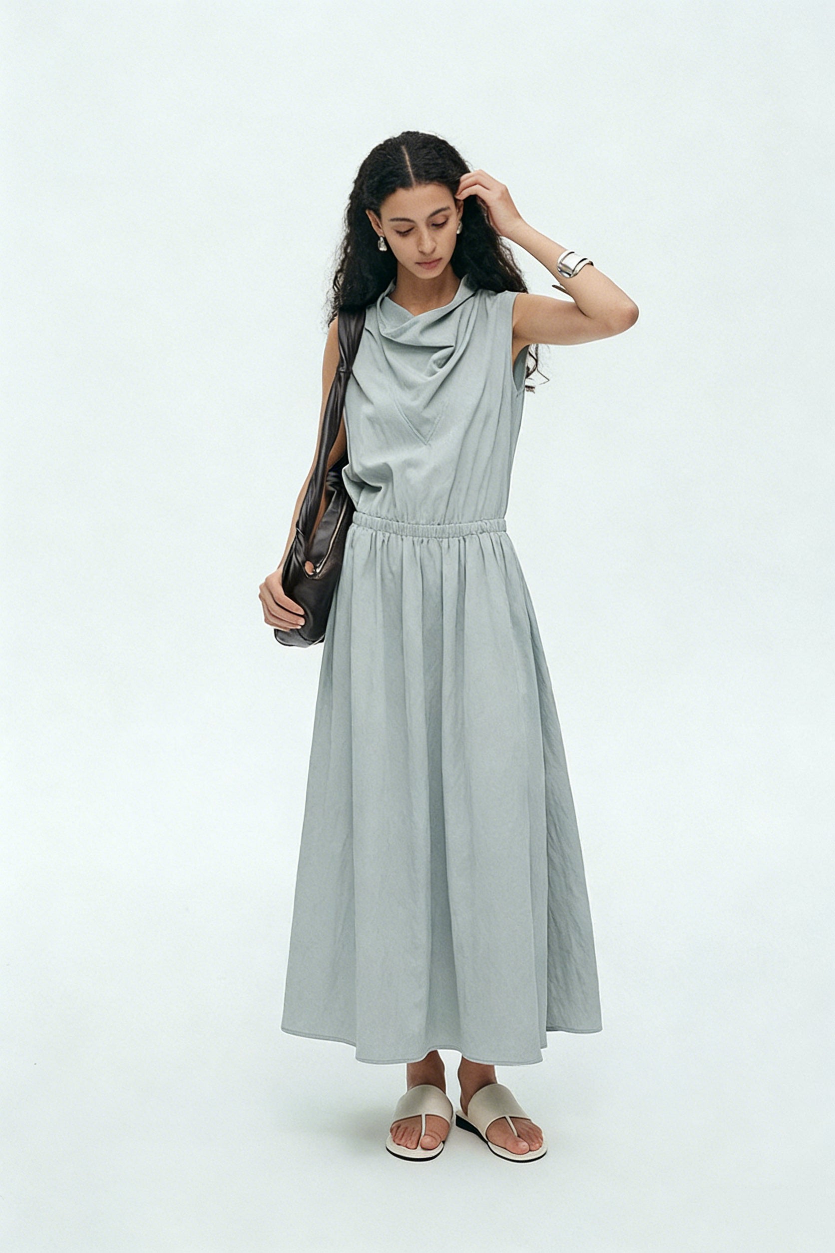 BapHood sage minimalist sleeveless cowl neck midi dress styled with sandals and shoulder bag