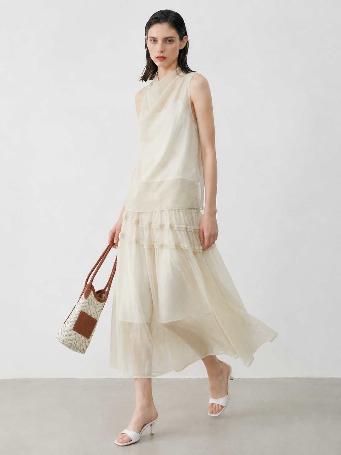 BapHood sand khaki skirt set shown in motion with sheer layering and delicate ruffle trim.