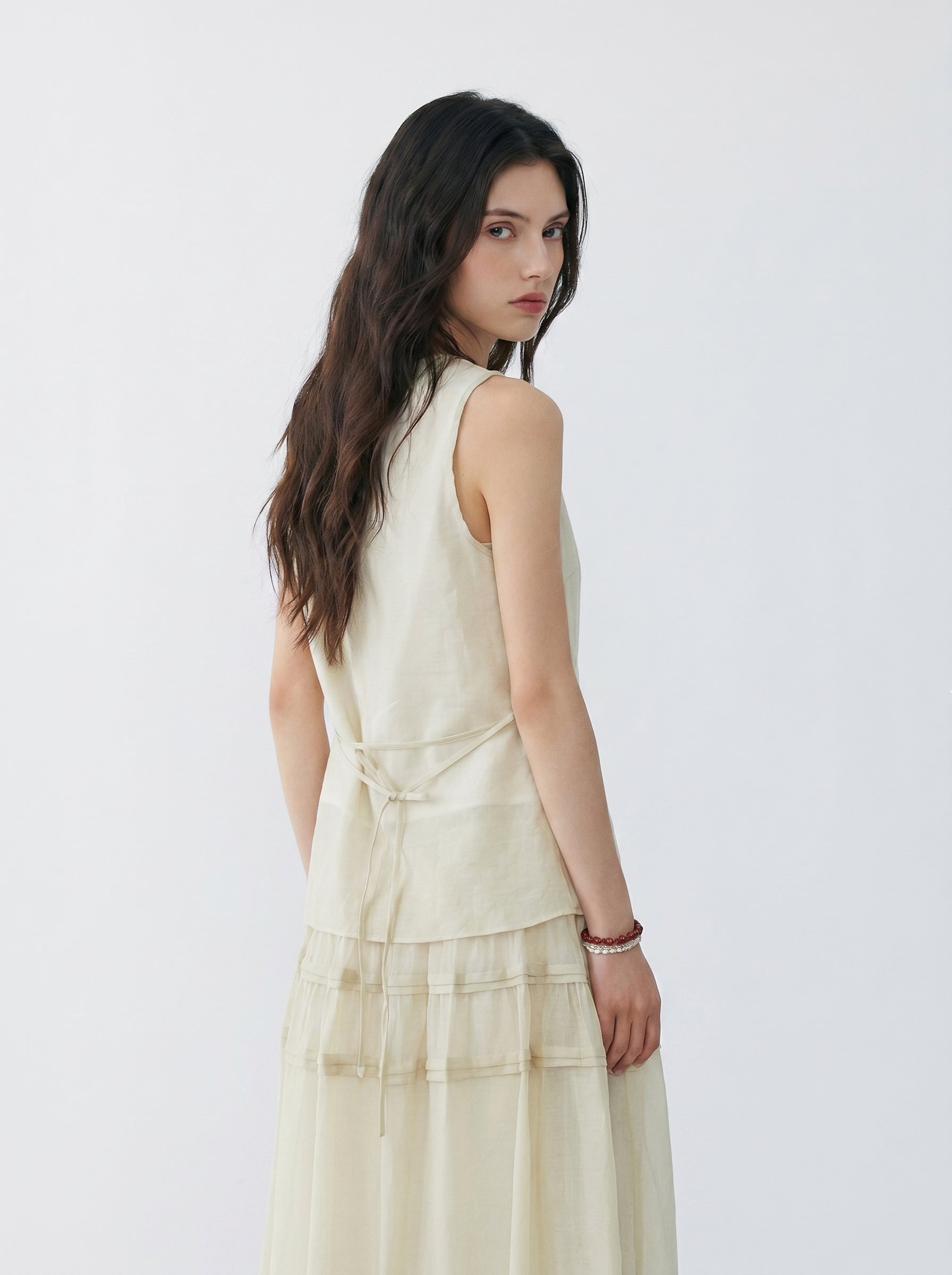 BapHood sand khaki two-piece skirt set showing the back view with a sleeveless top and layered