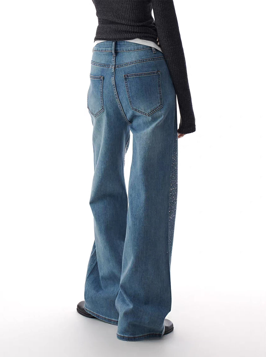 Back view of blue flare jeans with classic pockets and clean wash