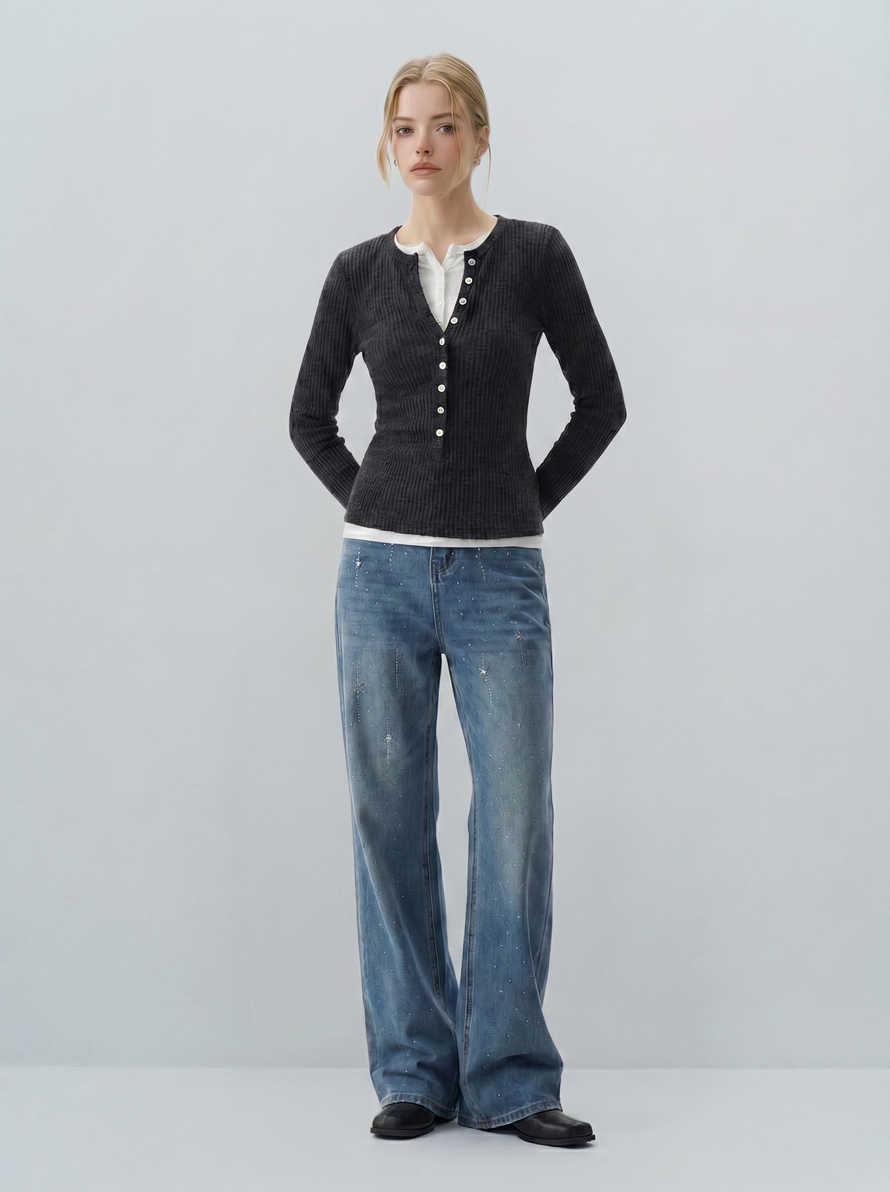 Starry rhinestone flare jeans in blue on model