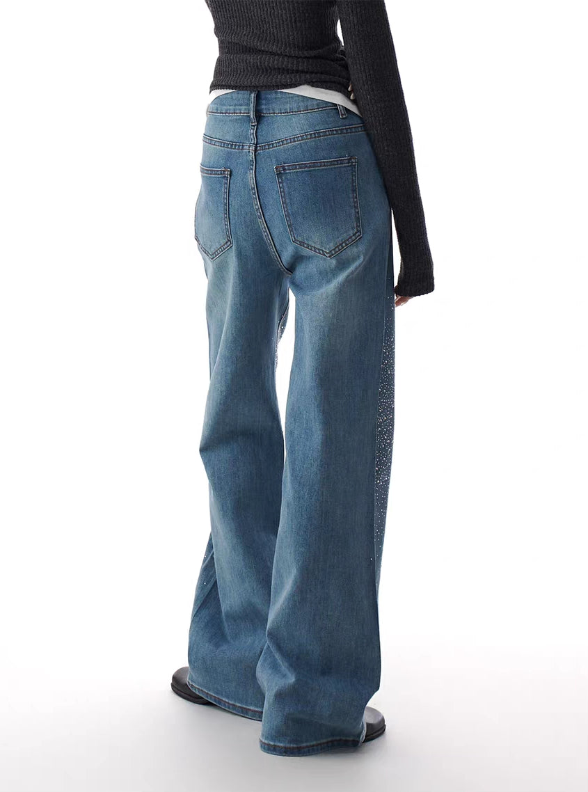 Blue rhinestone flare jeans, back view showing pockets