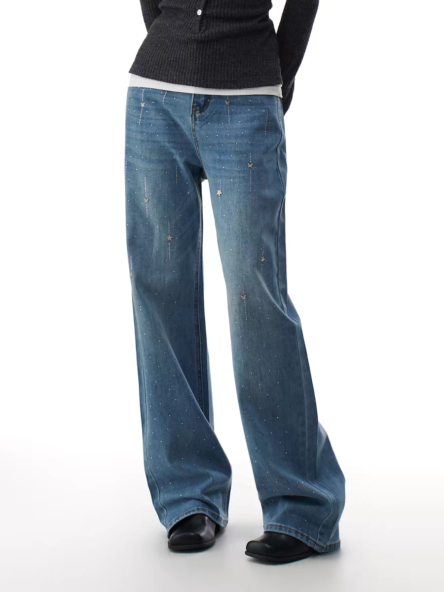 Blue flare jeans with starry rhinestone scatter, front view