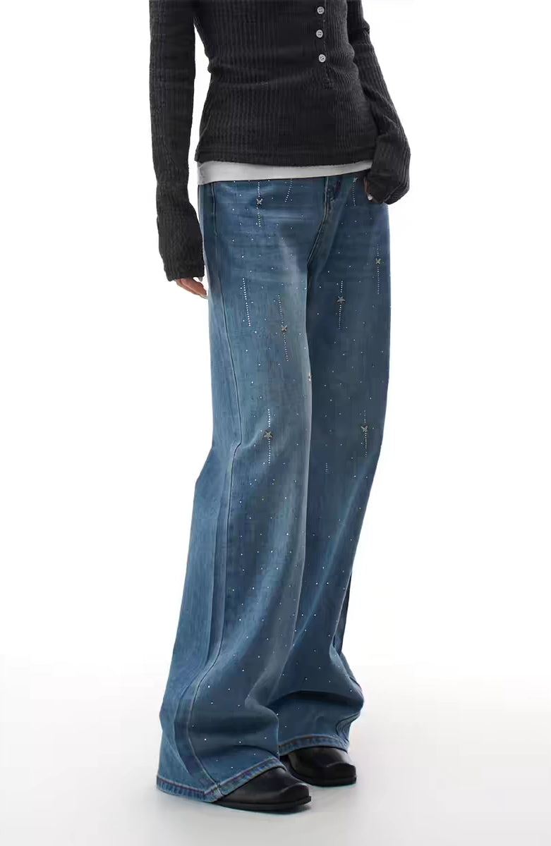 Blue flare jeans with starry rhinestone scatter, front view