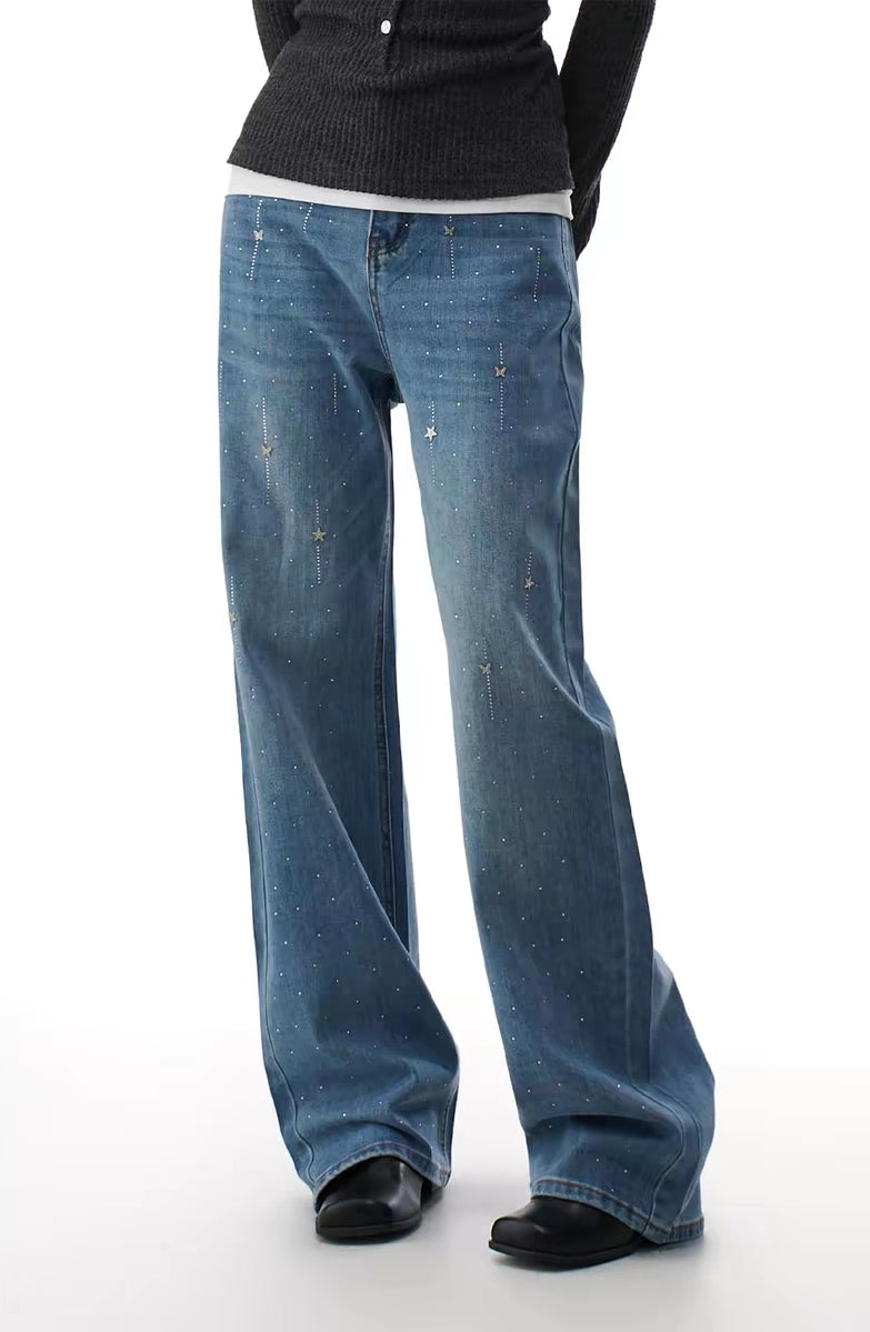 Blue sparkle flare jeans styled on model, full-body front view