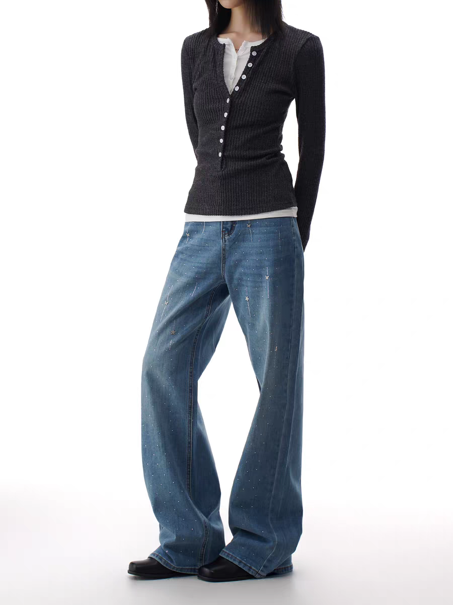 Blue flare jeans with starry rhinestone scatter, front view