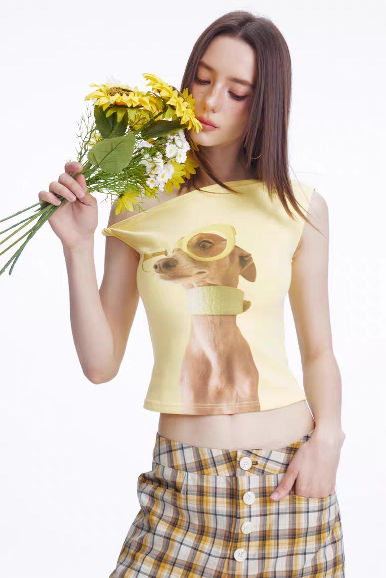 Front angled view of asymmetrical puppy graphic crop top showing neckline detail
