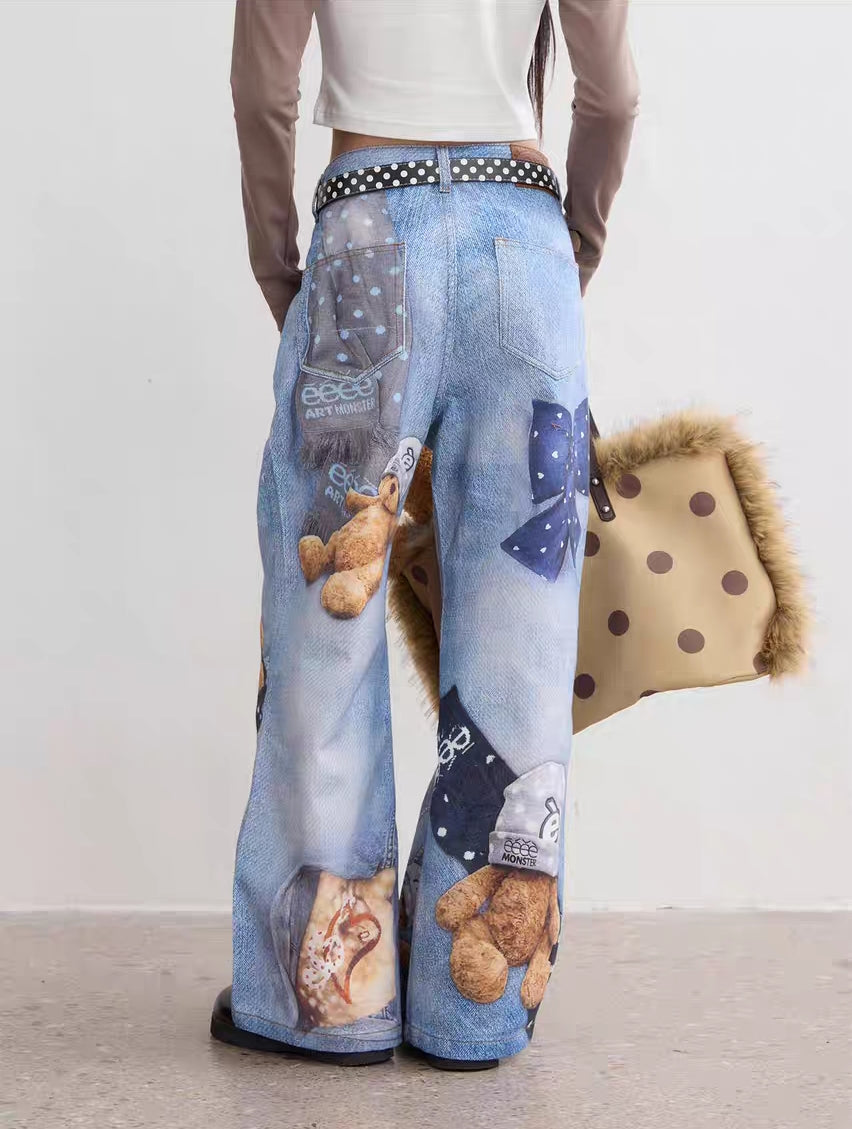 Back view of light wash wide-leg teddy print jeans showing rear pockets and graphic details